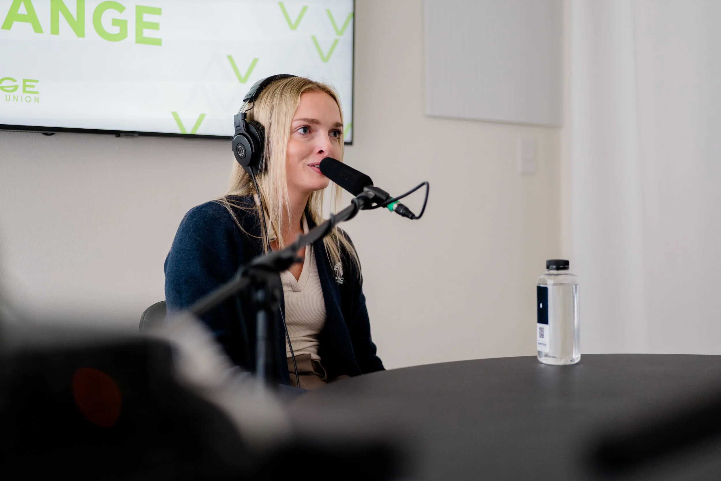 Paige Berg in podcast studio