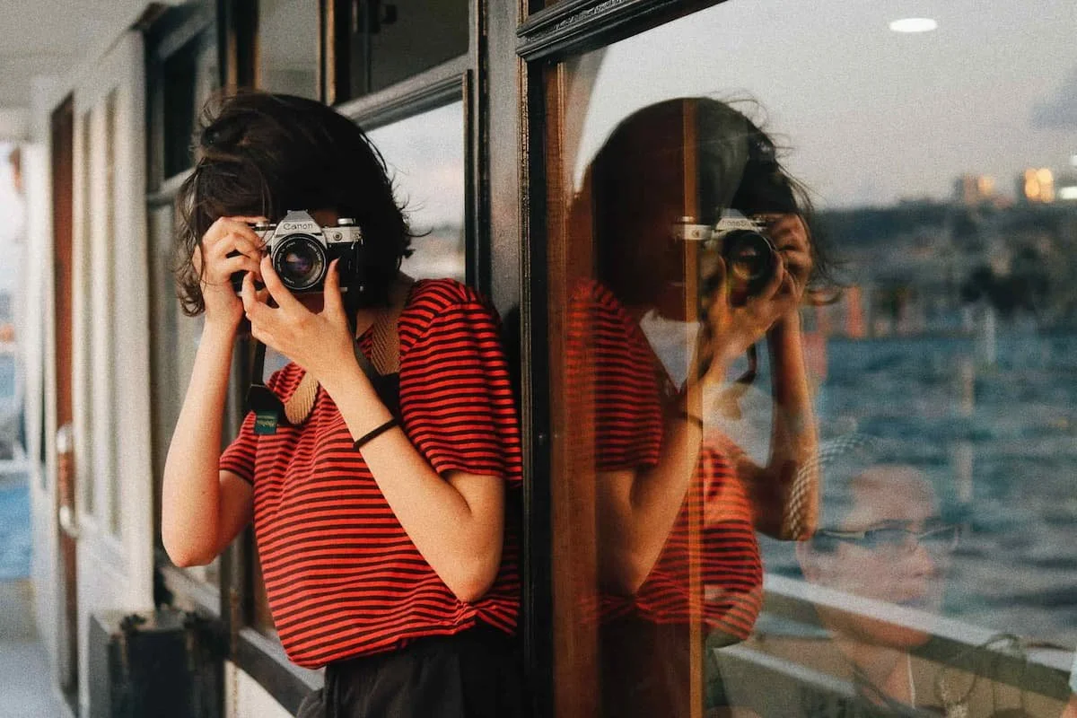 women taking a photo on boat