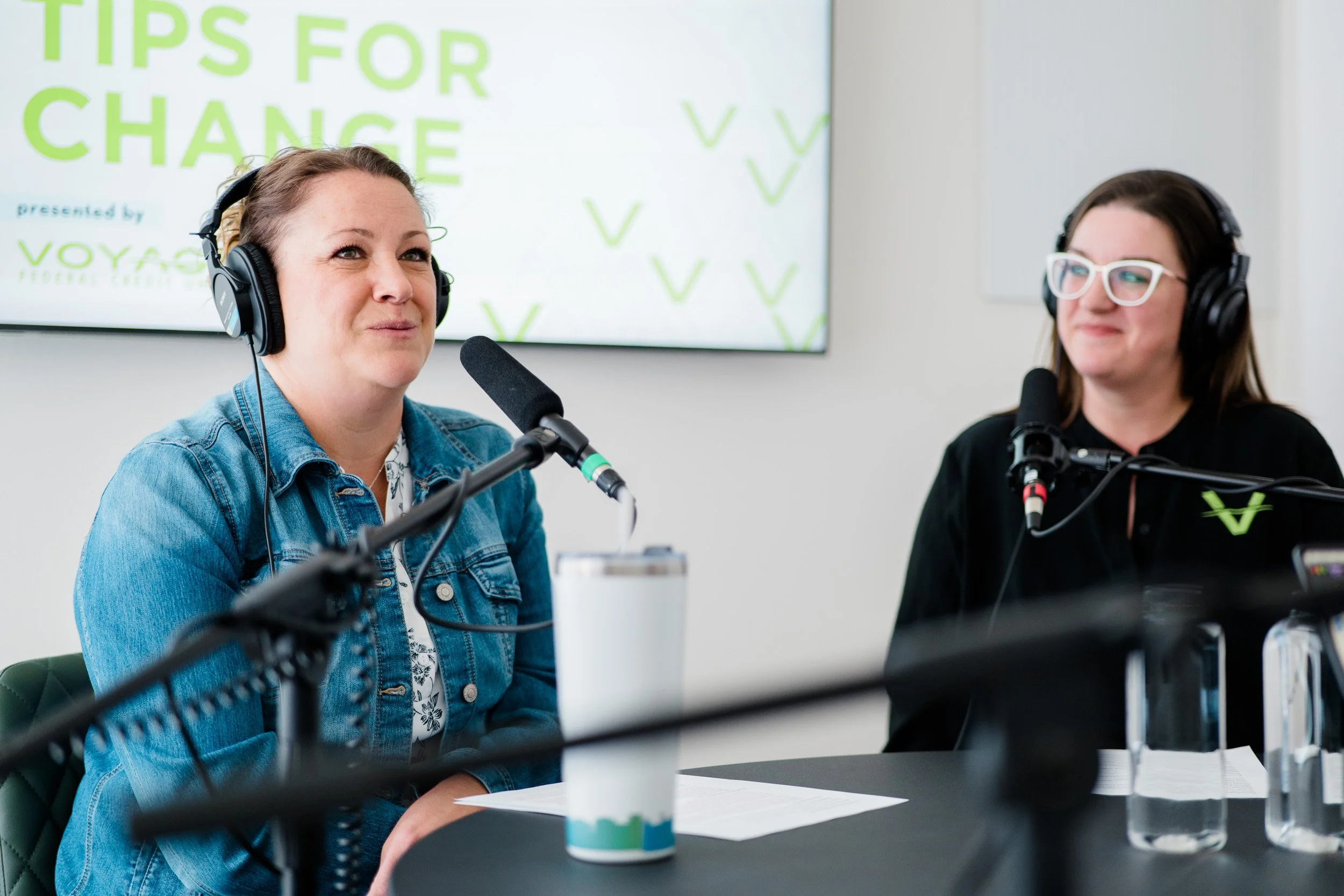 Two woman in a podcast studio