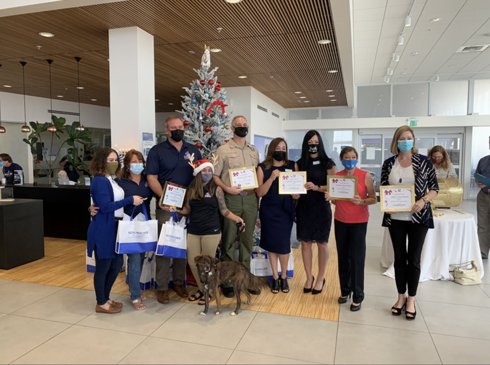 Schumacher Automotive Group donates $70K to local charities