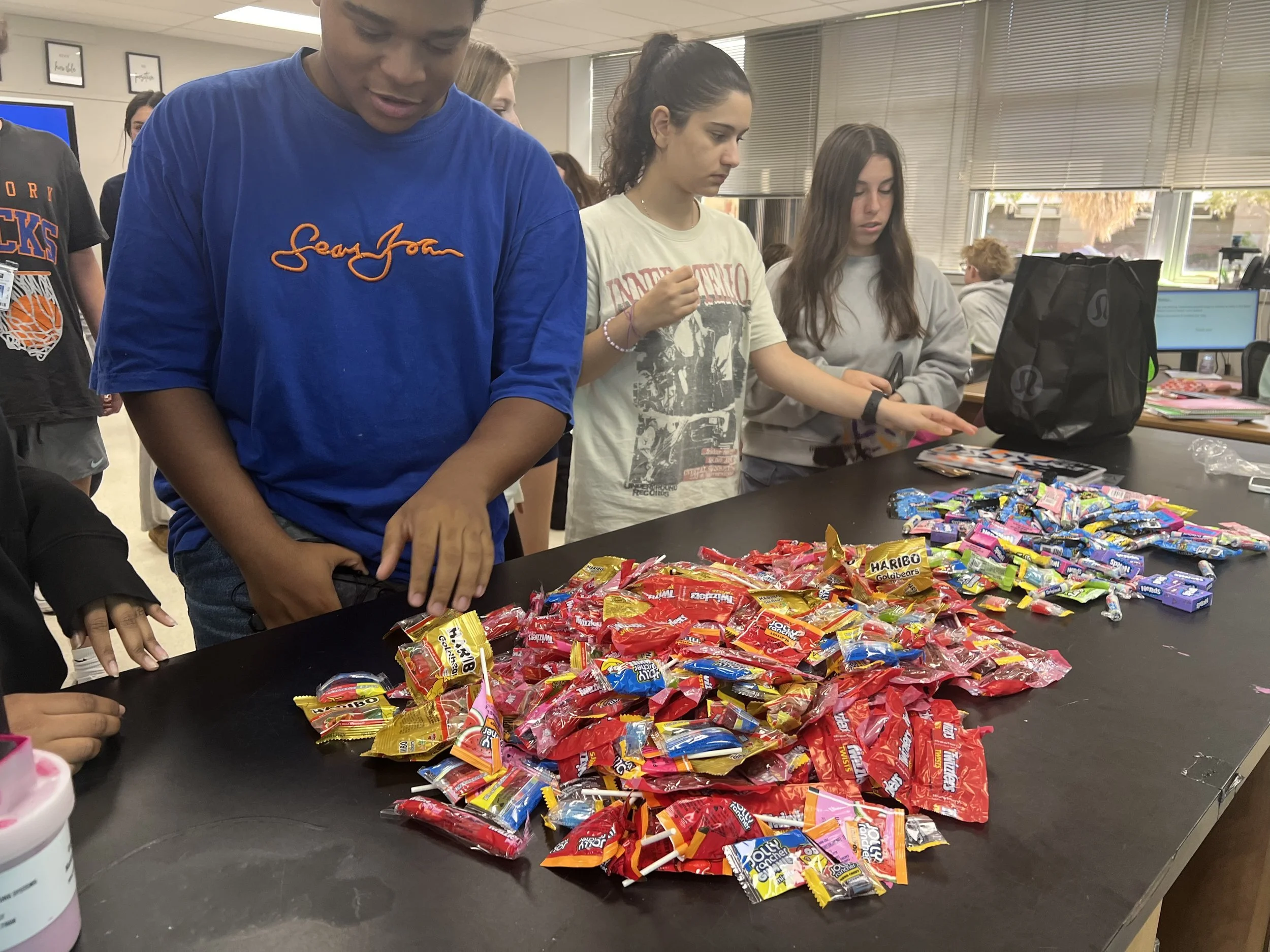 Olympic Heights Lions Share Halloween Joy with Goodie Bags