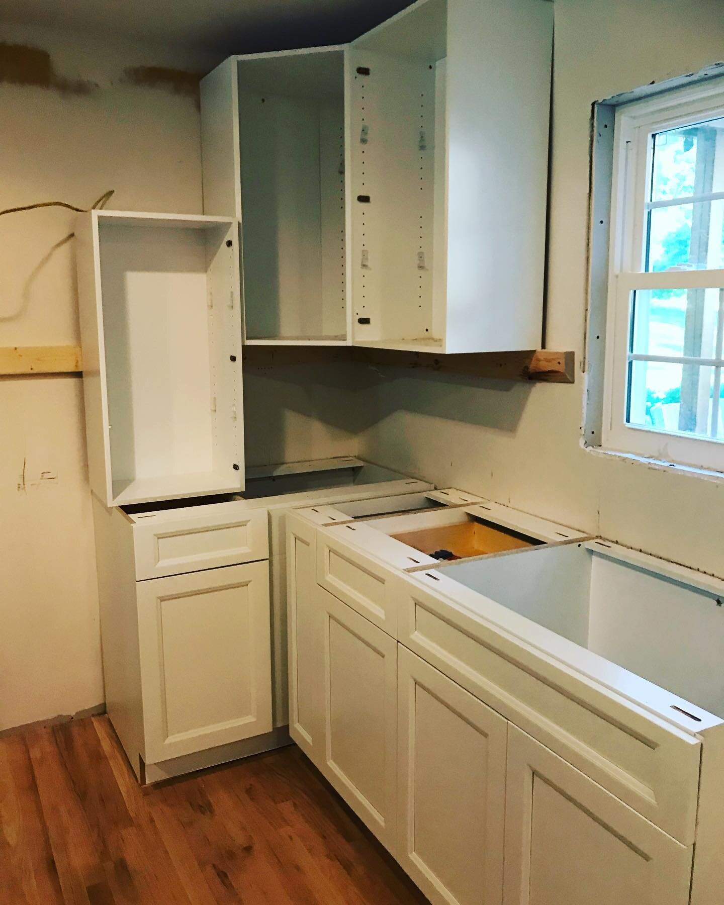 Cabinets are getting installed. I love to locate tray storage in a cabinet above the refrigerator but in this kitchen we needed to find another location. Swipe to see the handy pull-out for trays 🤓 #showplacecabinetry #kitchenremodel #kitchendesign 