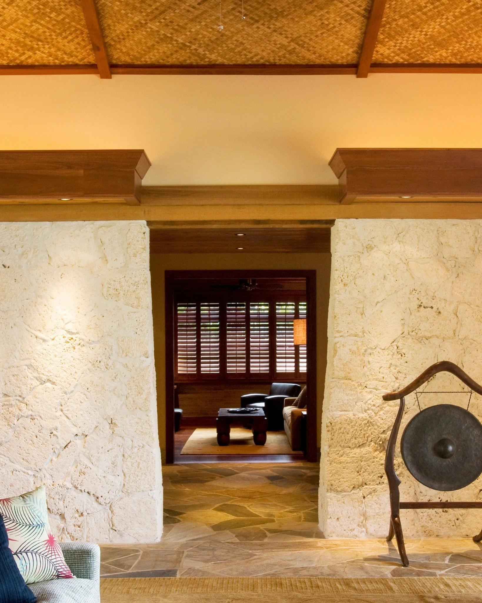 Fall in love with these material pairings 

Slide 1:
Coral stone walls, rich wood beams, and woven ceiling textures come together to ground this space in place. The contrast between raw stone and refined wood creates warmth, character, and a strong s