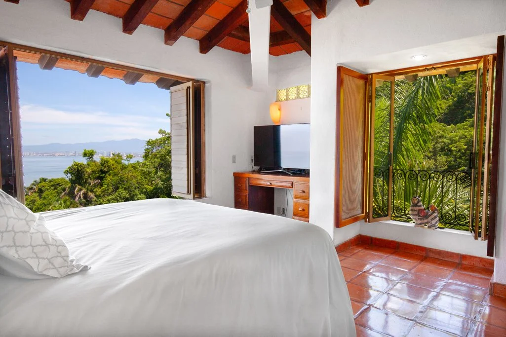 Design-forward terrace with open bay views in Puerto Vallarta, interior living space overlooking the Pacific