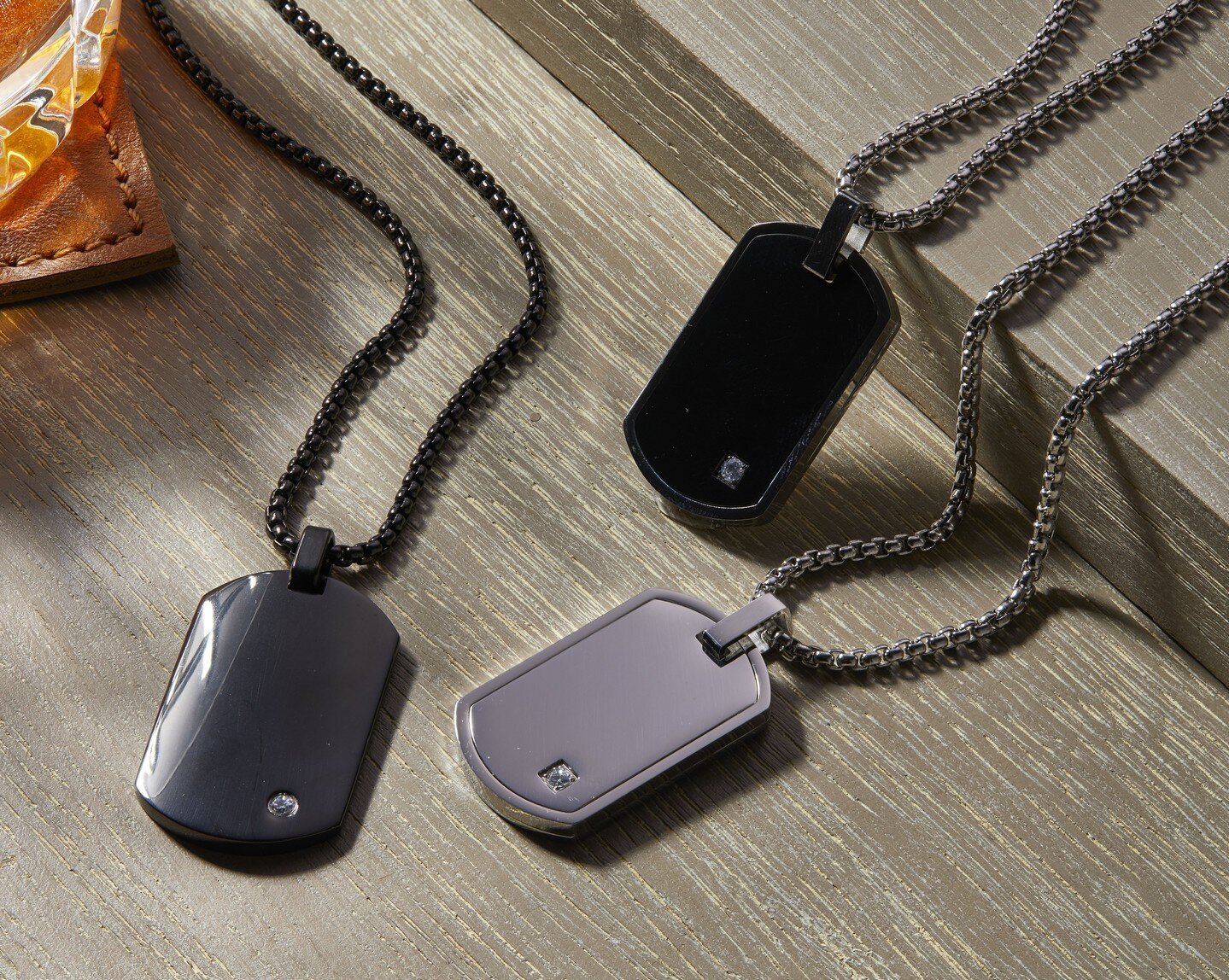 A modern take on the classic dog tag. #GeoffreyBeene