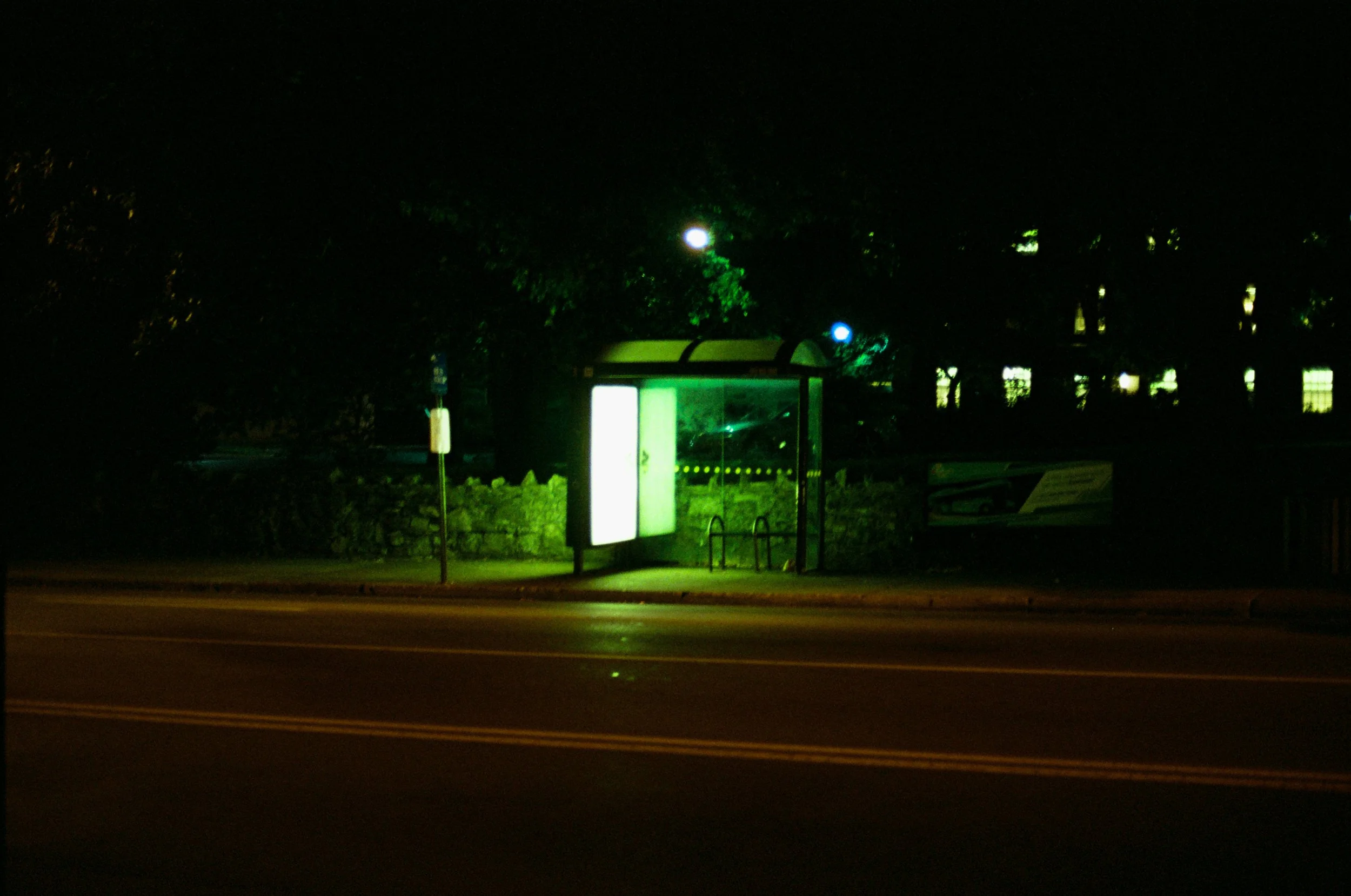 The Lonely Bus Stop bathed in green light