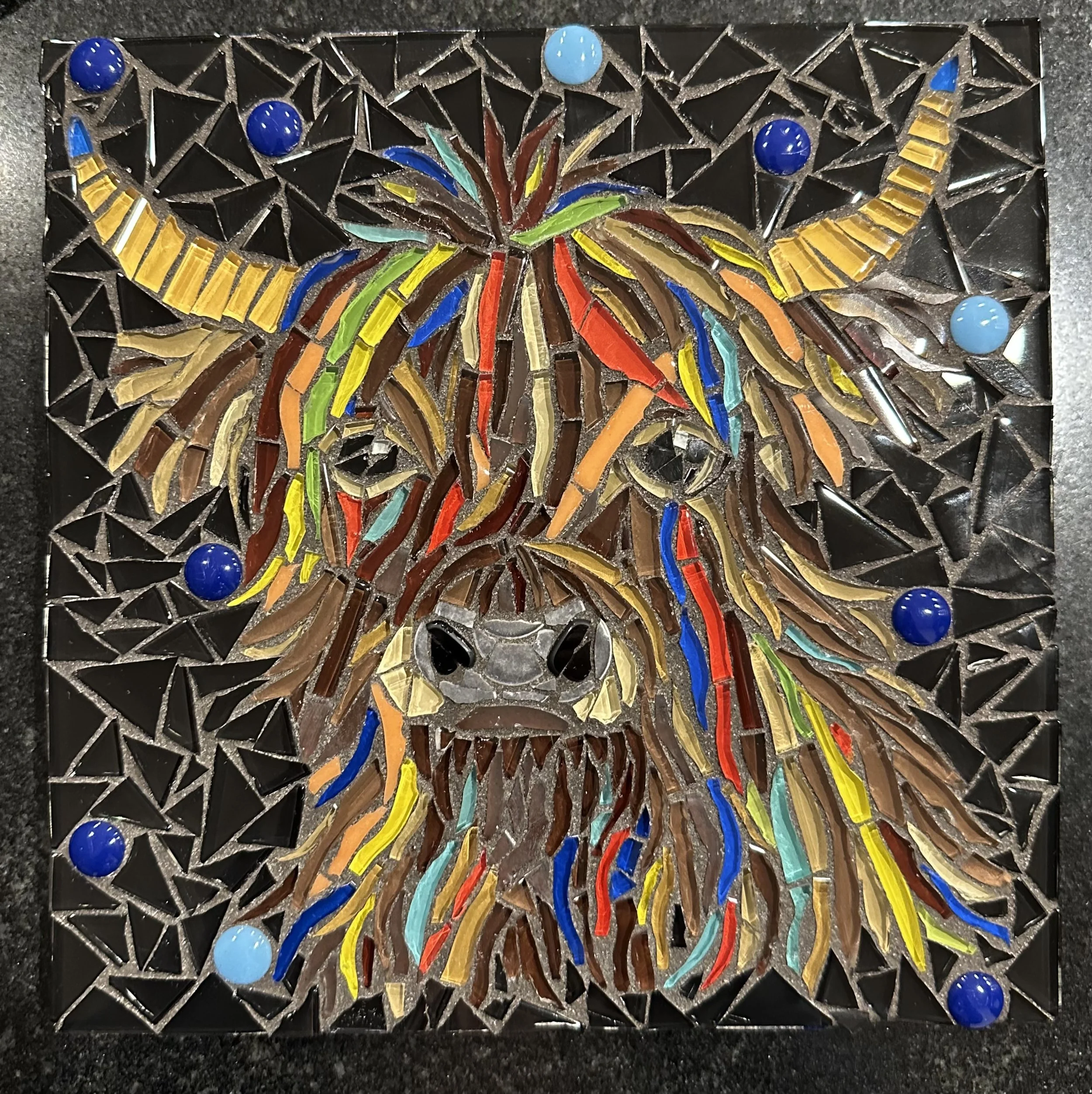 Rainbow color mosaic highland cow