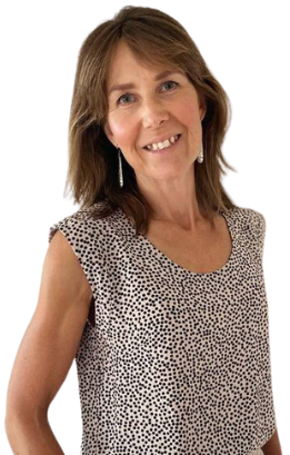 Specialist Literacy Educator Heather Down supporting a young male student as they play the Yeet literacy card game to practise decoding and reading skills.