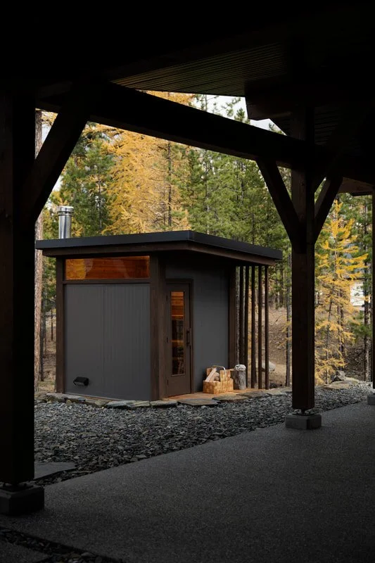 Mettä backyard sauna seen from a covered patio, Kootenays, BC