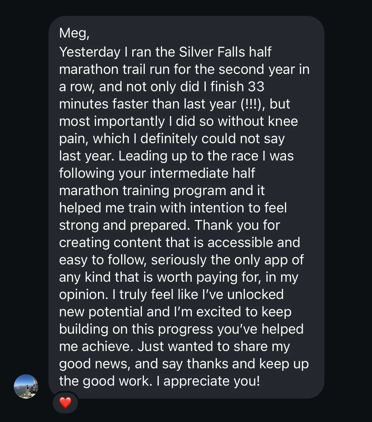 A woman running outdoors on a bridge or pathway, wearing a black sports bra and black shorts, with her hair tied up in a bun.