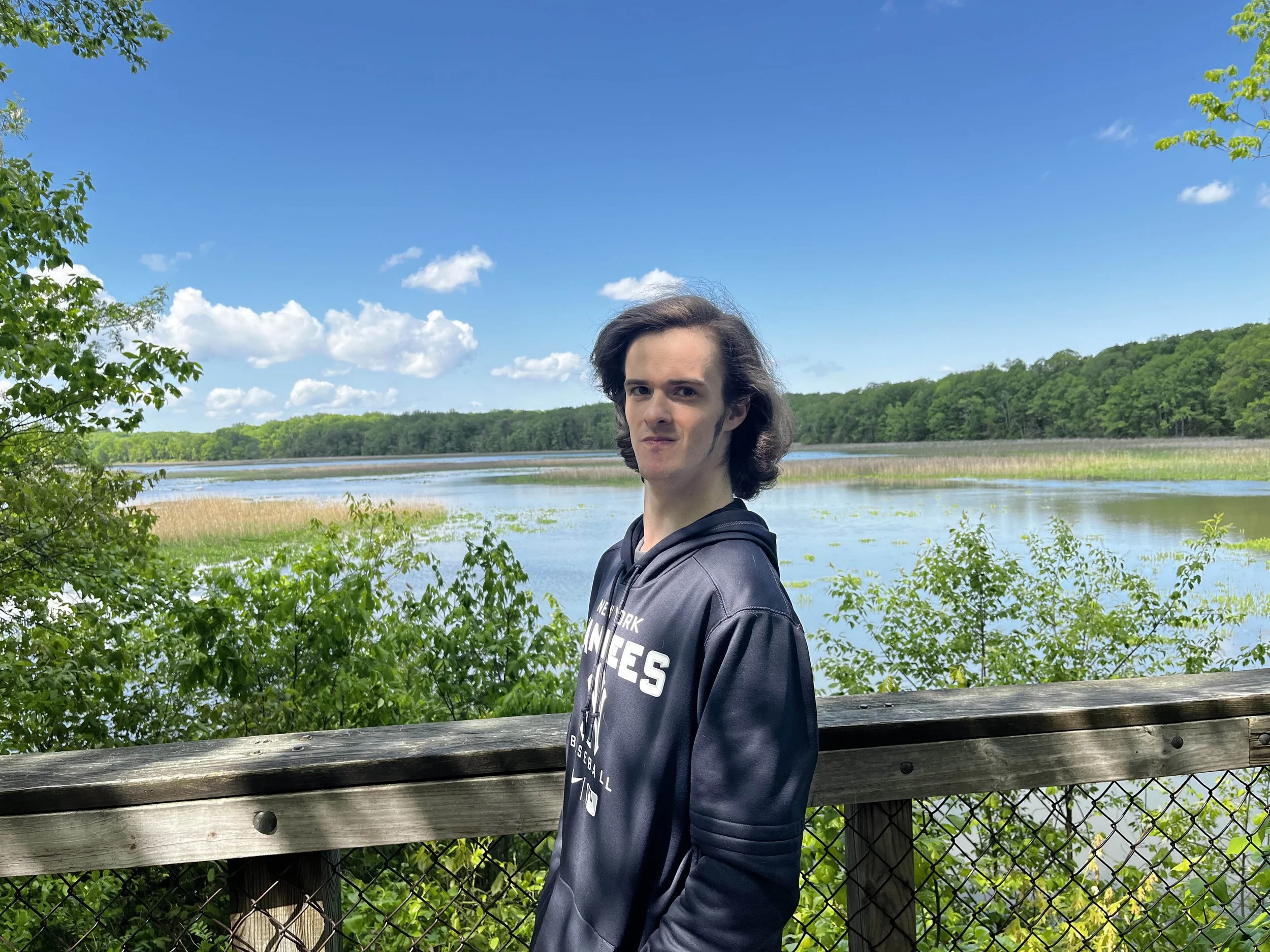 Ben Gibbs, Pursuit's web designer, standing in front of a marsh