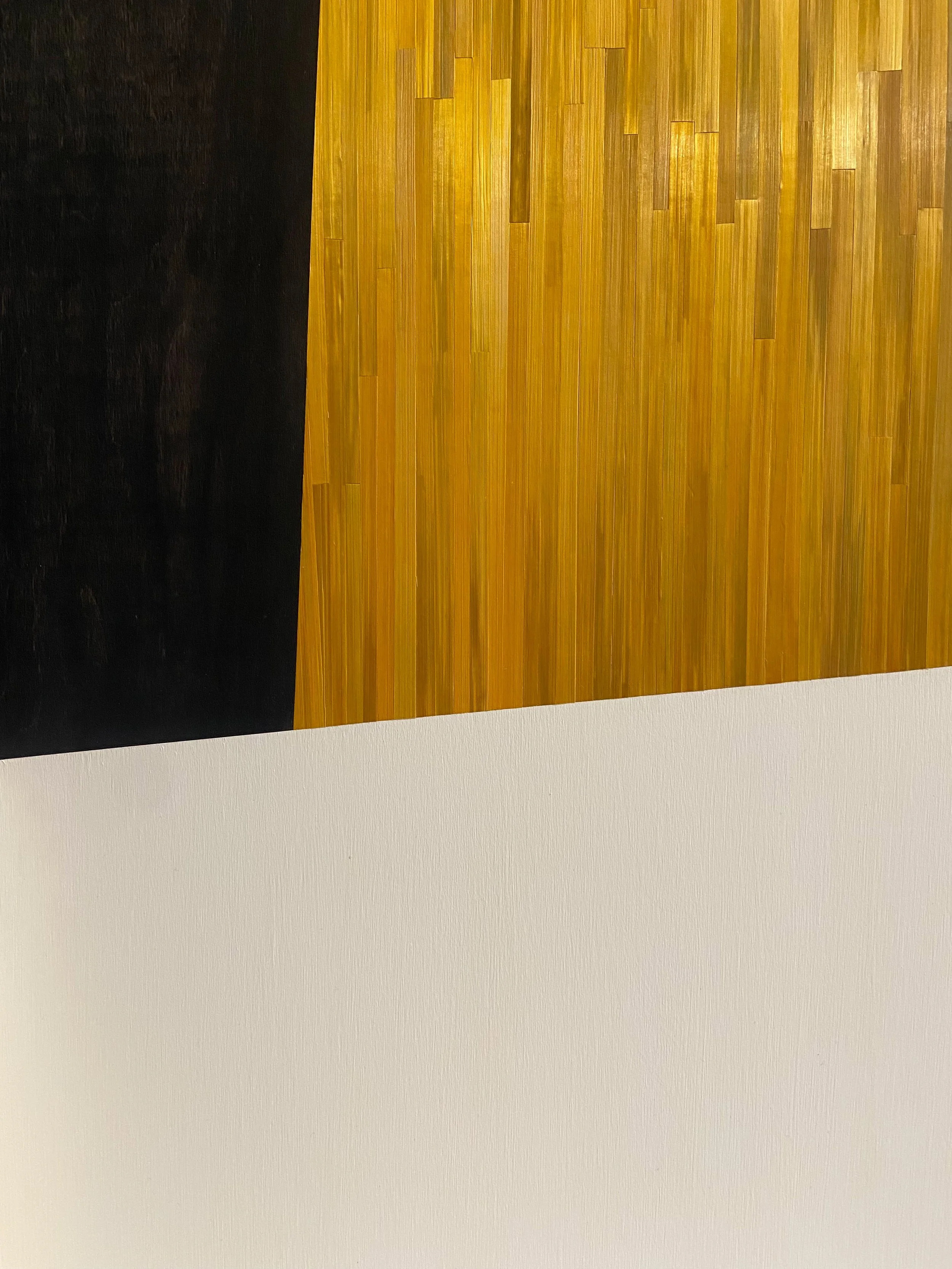 Close-up of Eltham Screen by Eleanor Nadimi, showing hand-applied golden rye straw marquetry alongside black and cream painted forms.
