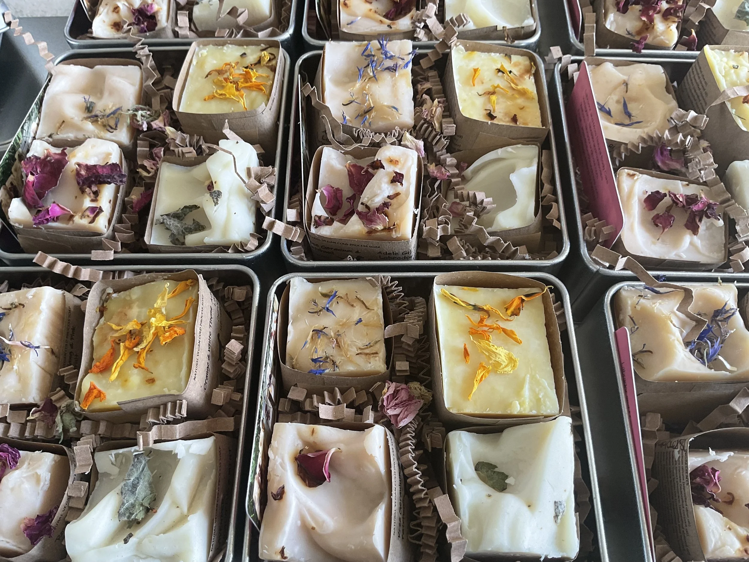 A line up of mini gift tins