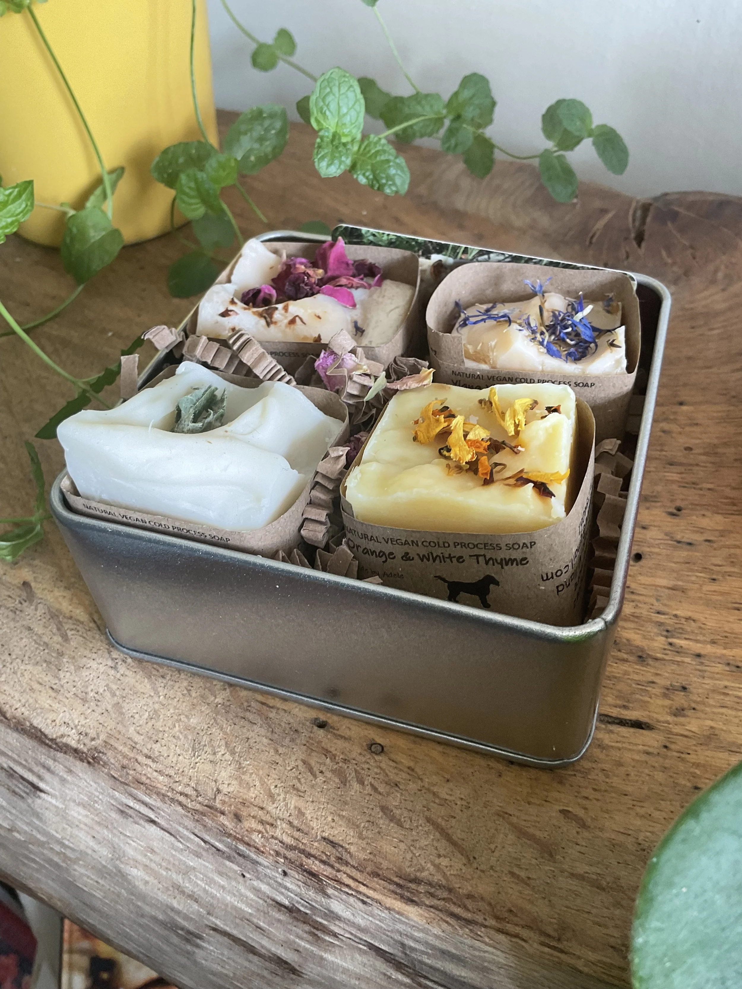 Tin of mini soaps all made with different essential oil blends