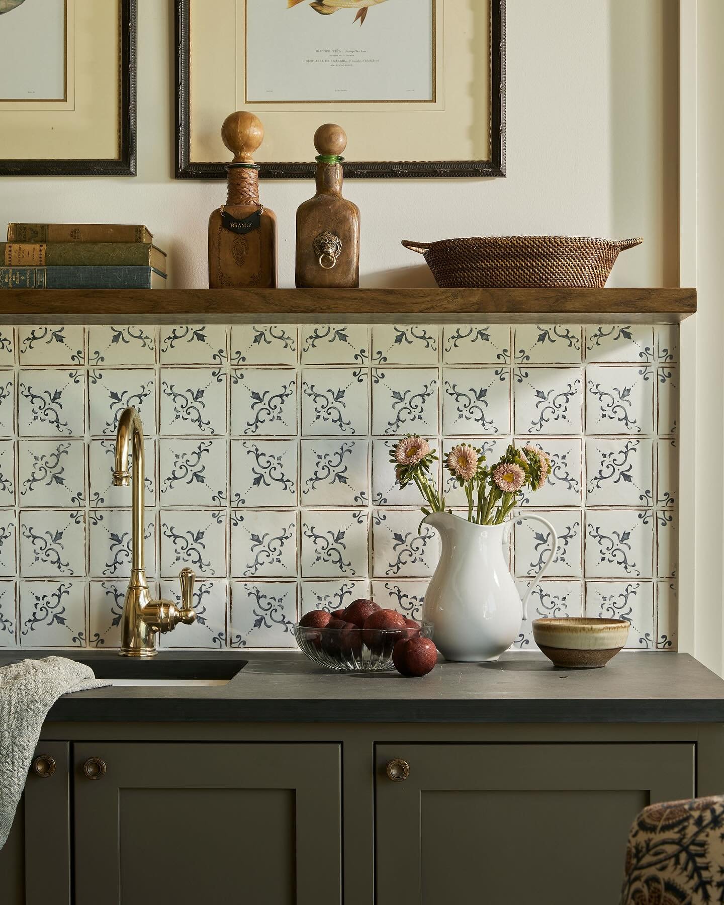 It&rsquo;s the hand-painted tiles for us&mdash;delicate, imperfect, and quietly striking. They bring just enough pattern to give this bar nook soul, without overwhelming the space. Proof that a great tile choice can turn even the smallest corner into