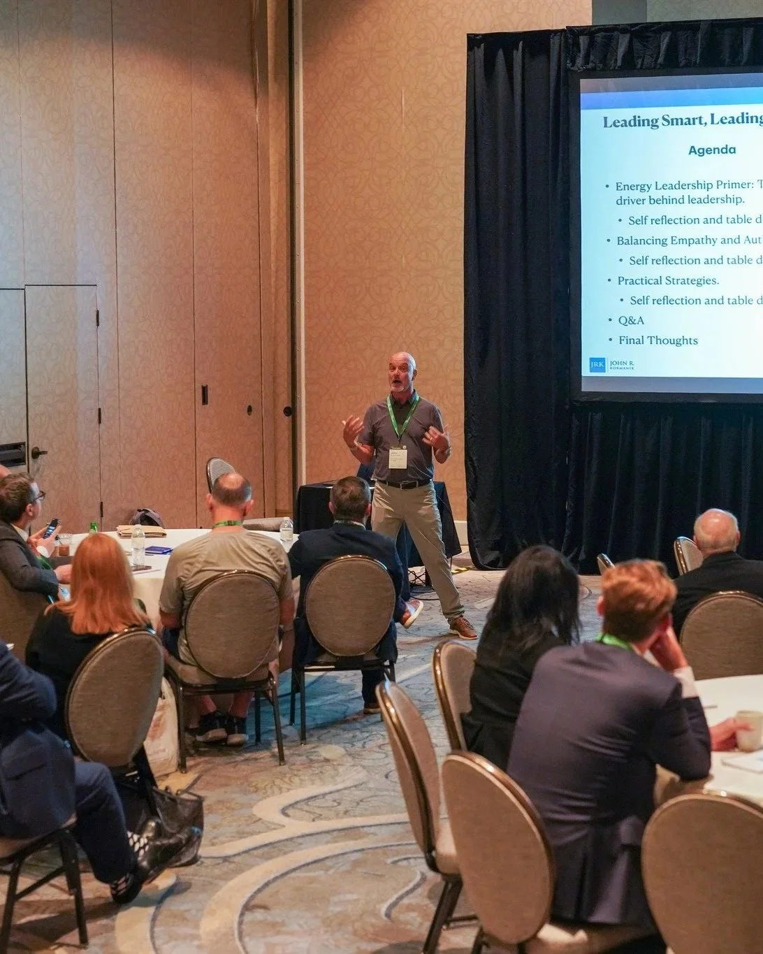 John R. Kormanik speaking at a leadership event, featured in the section for his Burnout Tactical Guide and the Edge Index Assessment for lawyers.