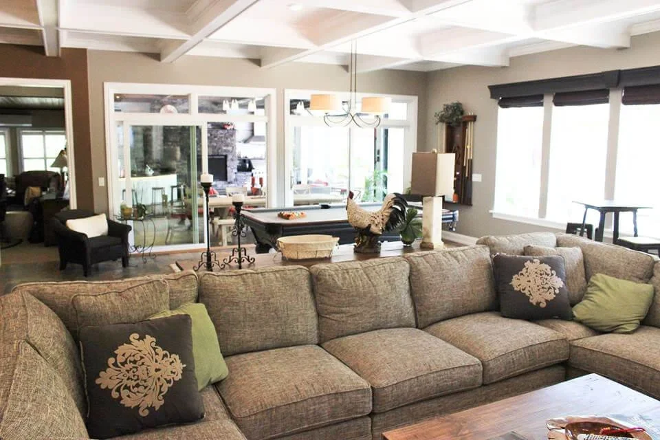 The interior of a custom Lake Norman home's living space, featuring large windows.