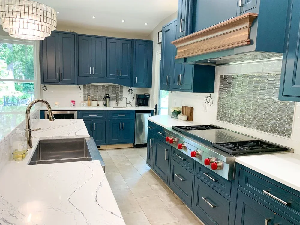 A bright and modern custom kitchen with slate blue cabinets.