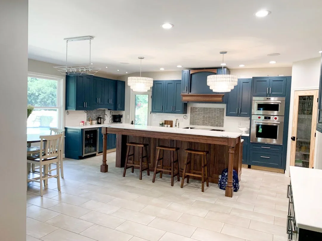 An open concept home with a newly renovated and massive kitchen island.