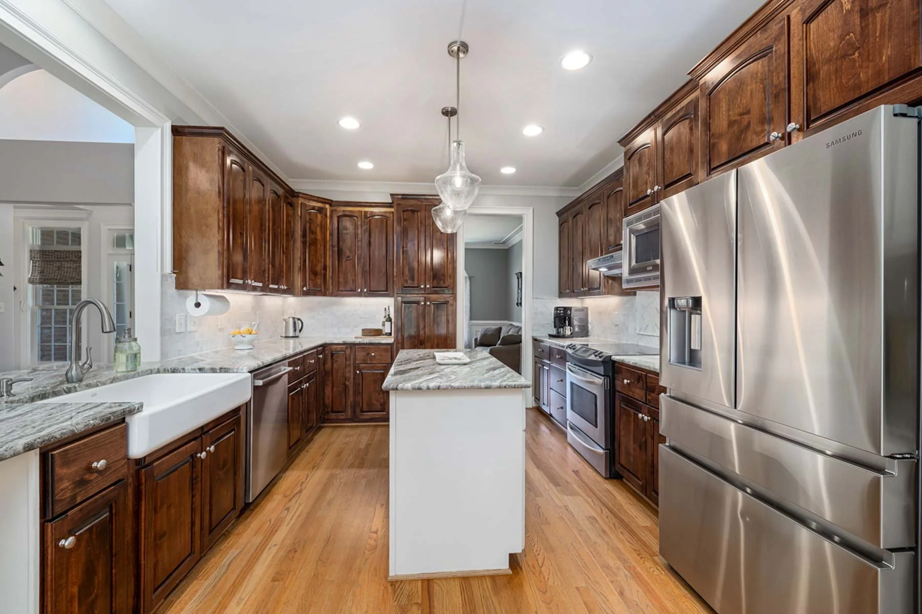 A modern kitchen remodel with classic cabinetry and contemporary appliances.