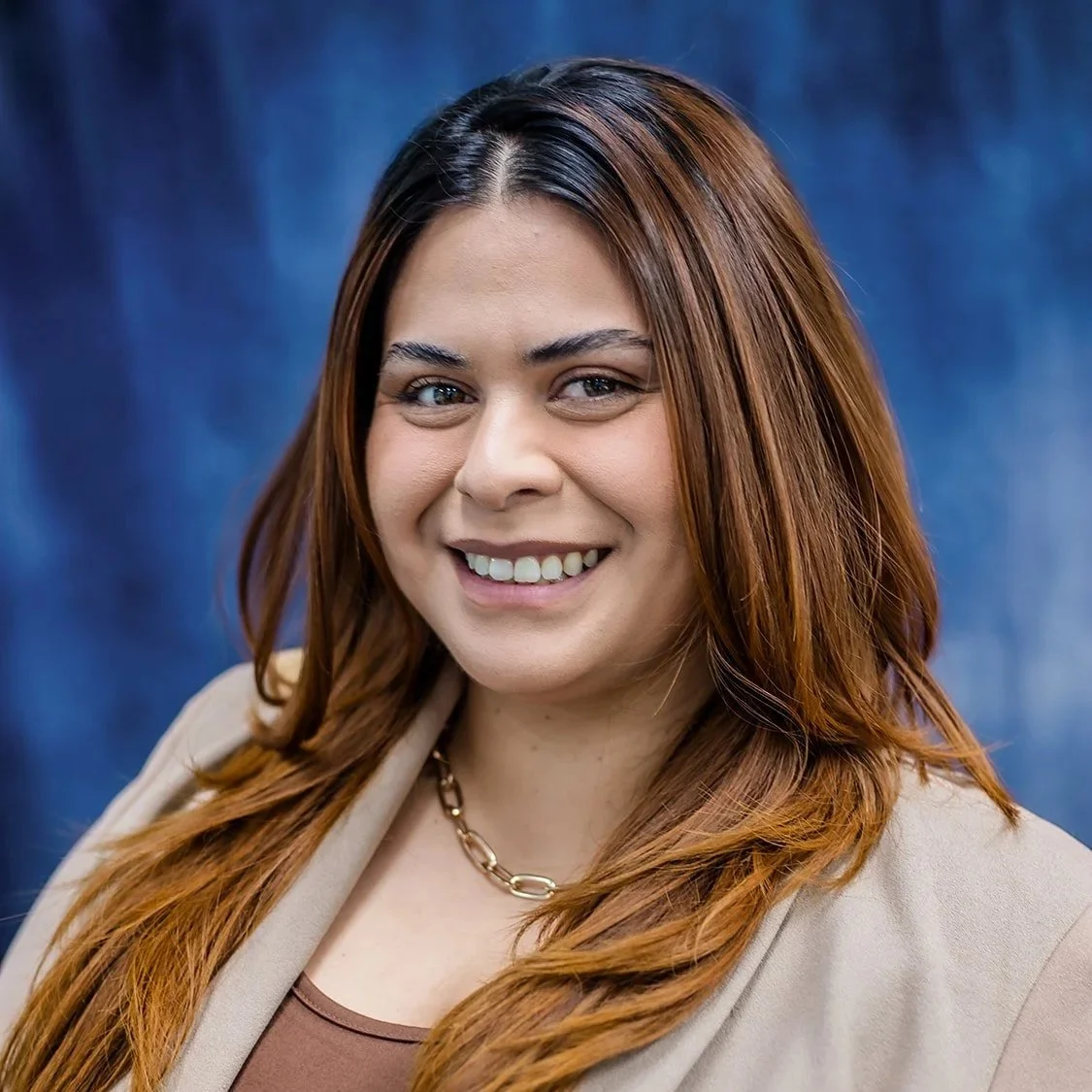 Woman with brown hair smiling 