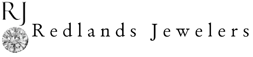 Logo with a sparkling diamond graphic and the text 'Reclanda Jewelers' in black.