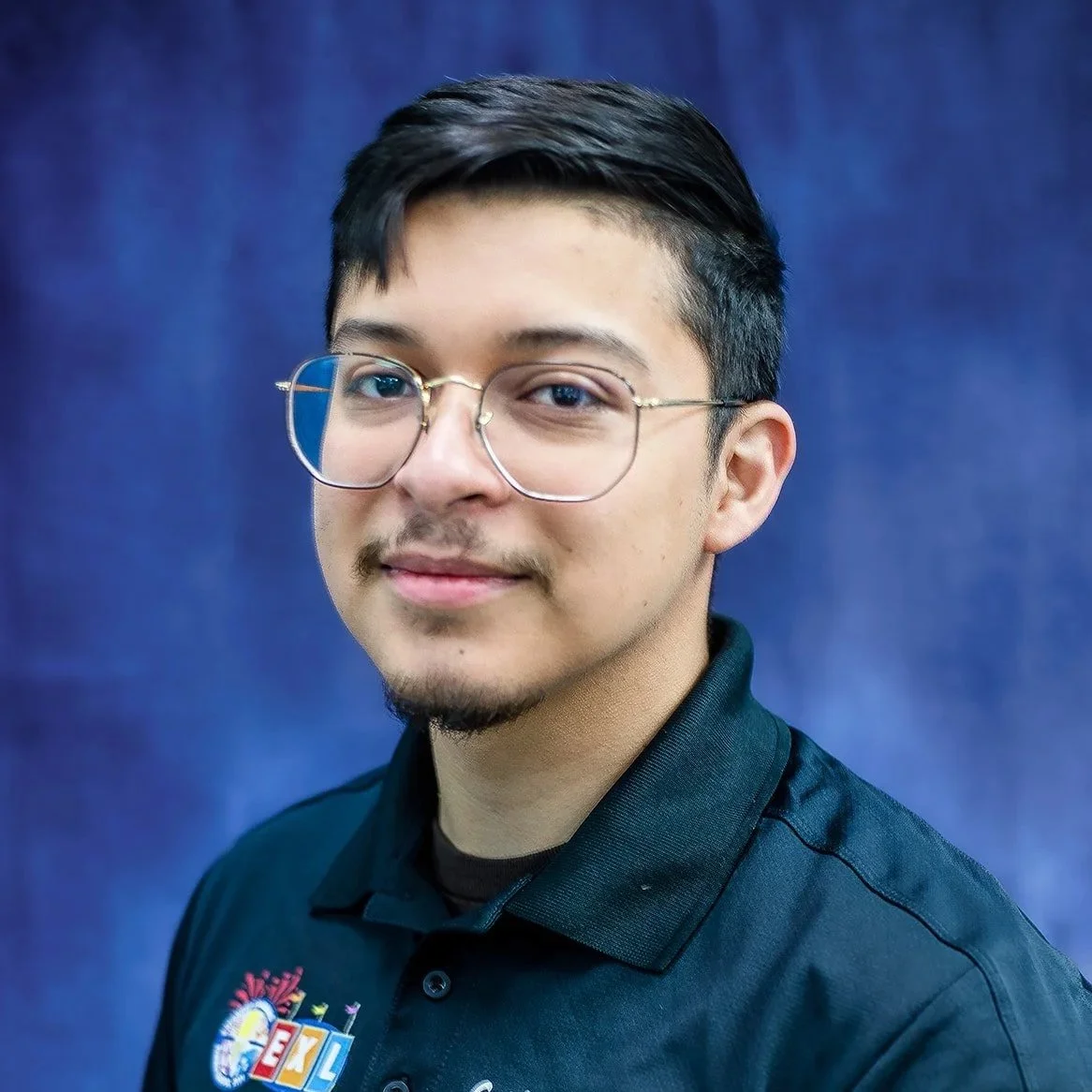 Man with glasses and a black shirt