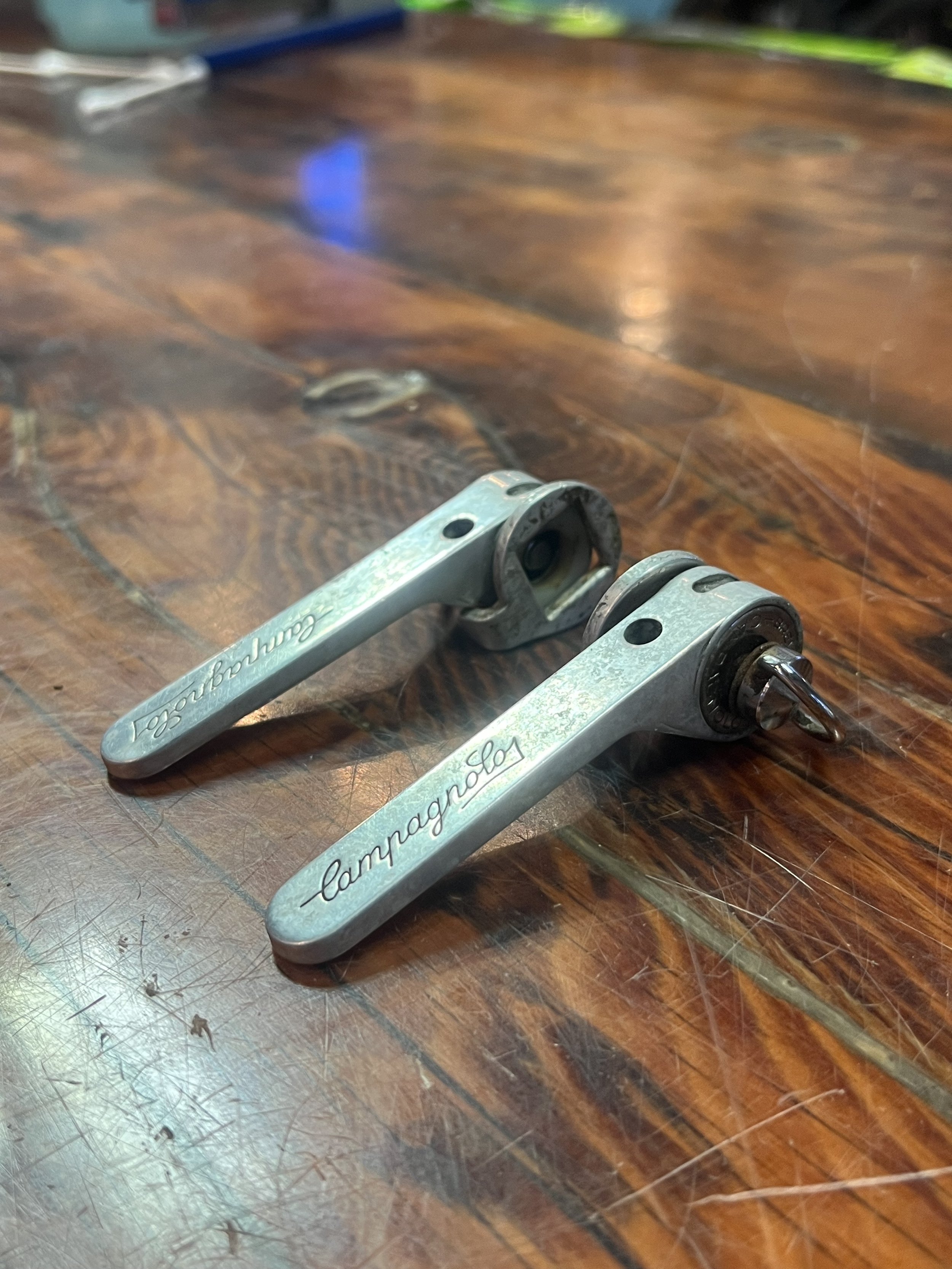 Photo of a vintage pair of Campagnolo Triomphe downtube shifters for sale.