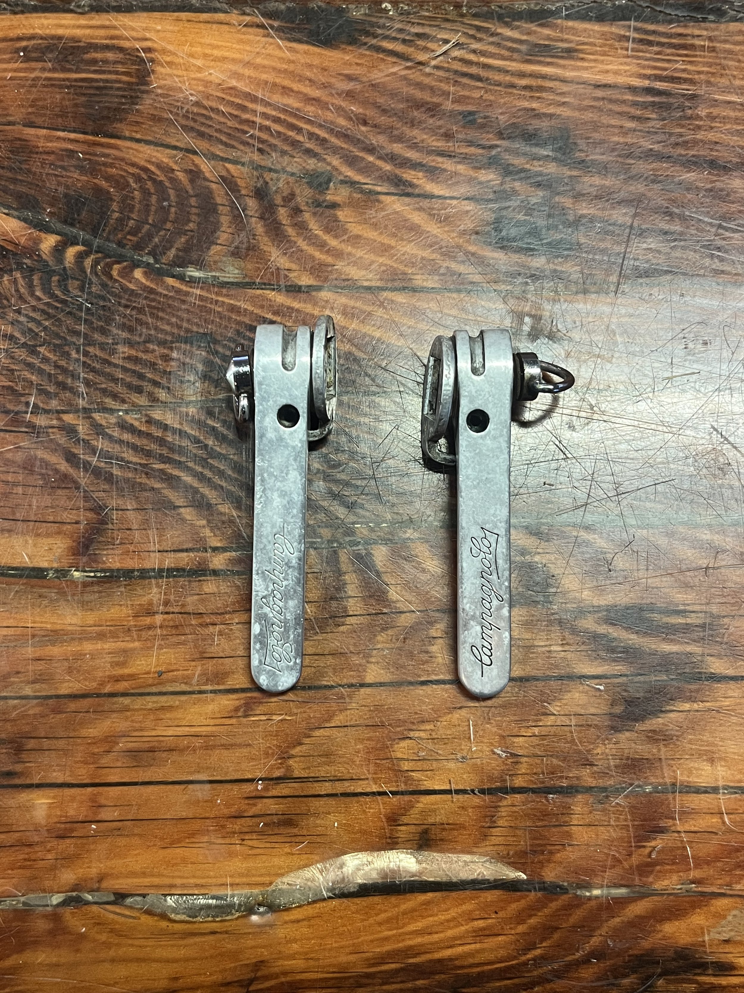 Photo of a vintage pair of Campagnolo Triomphe downtube shifters for sale.