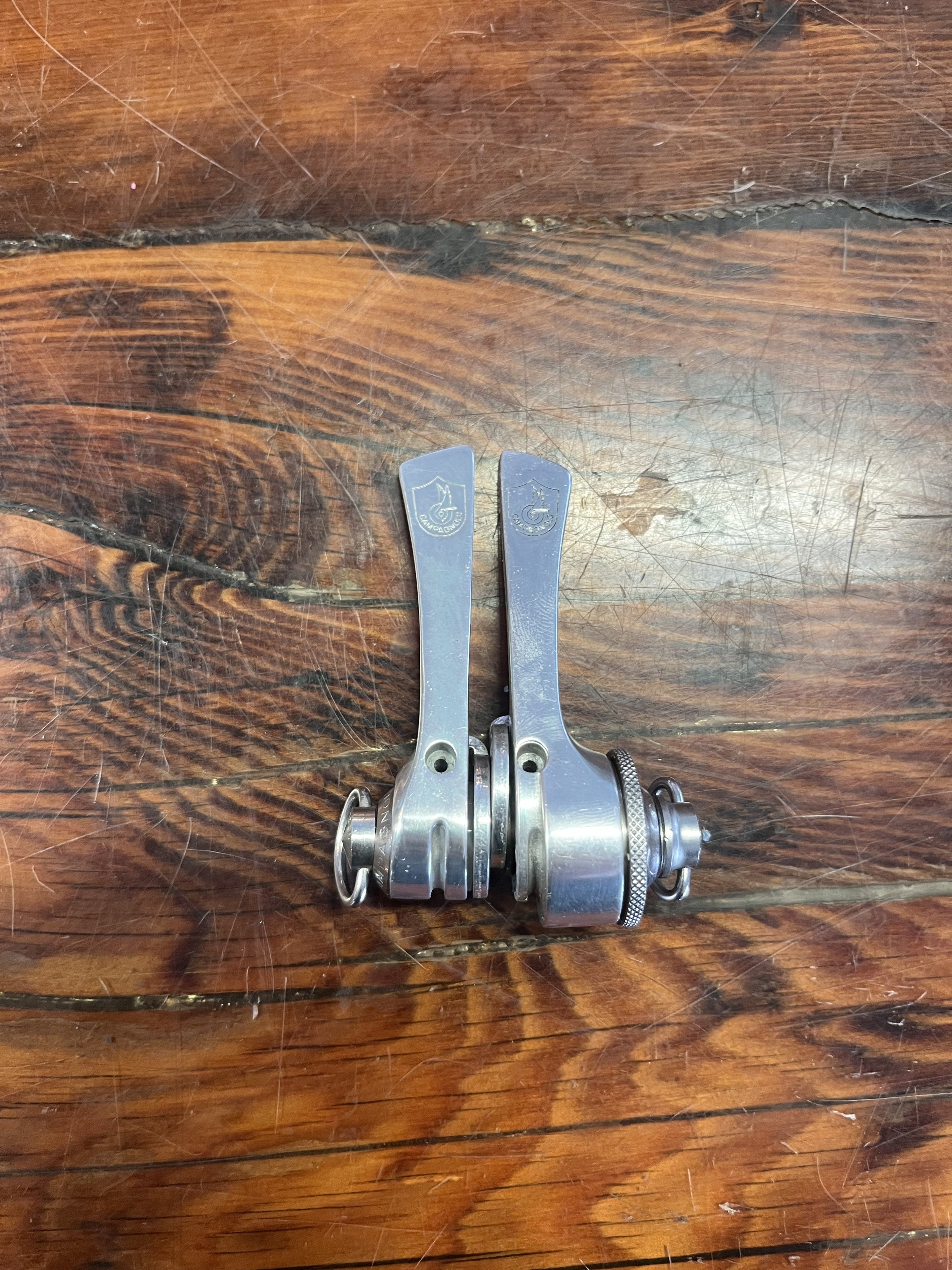 Photo of a pair of vintage Campagnolo C-Record Synchro Chorus downtube shifters for sale.