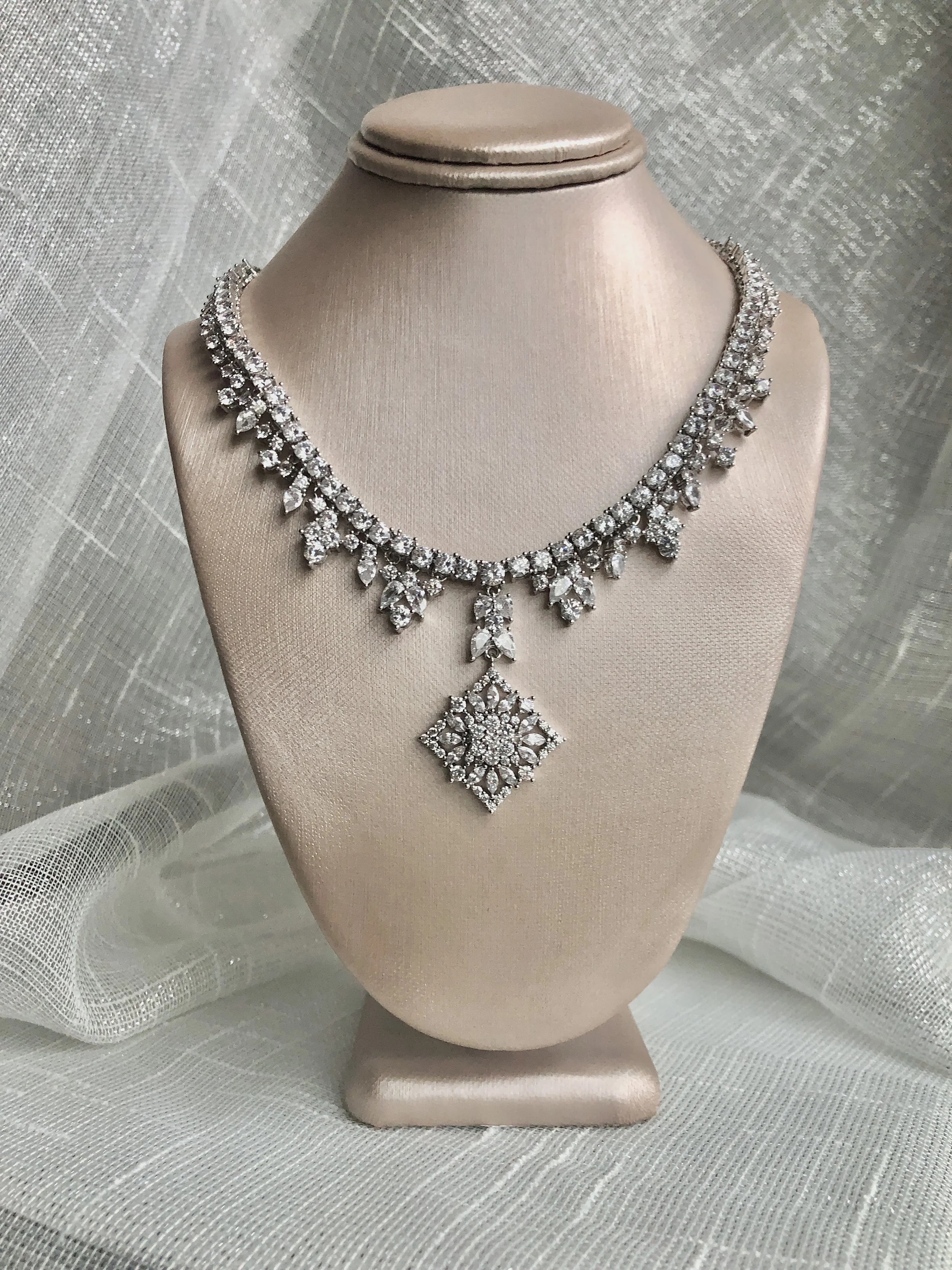 Inspired by the shimmery brooch found in my mother’s jewelry box, the Timeless Collection is a unique mix of faceted CZ stones illuminating timeless designs.