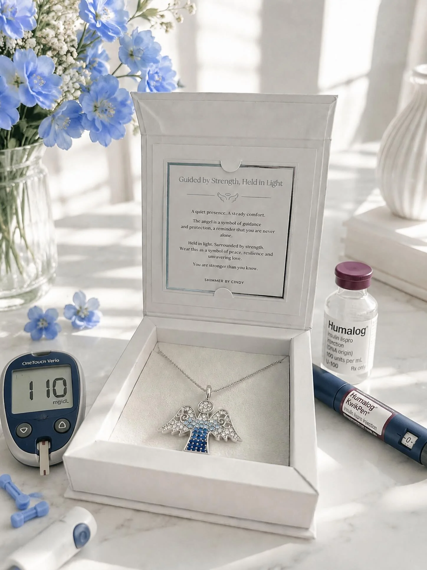 For the moments she carried you&mdash;and the strength she still holds. 👼
The Angel Necklace in sapphire blue is a symbol of guidance, protection, and quiet resilience. Thoughtfully designed for our Diabetes Awareness Collection and presented in our