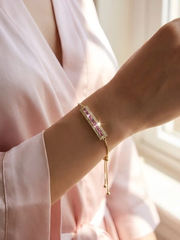 Soft pink meets bold Art Deco glamour. ✨
Our Art Deco Chain Bracelet is the perfect layering piece&mdash;designed to mix seamlessly with your favorite stacks or shine beautifully on its own. A timeless touch of pink that feels effortlessly chic for s