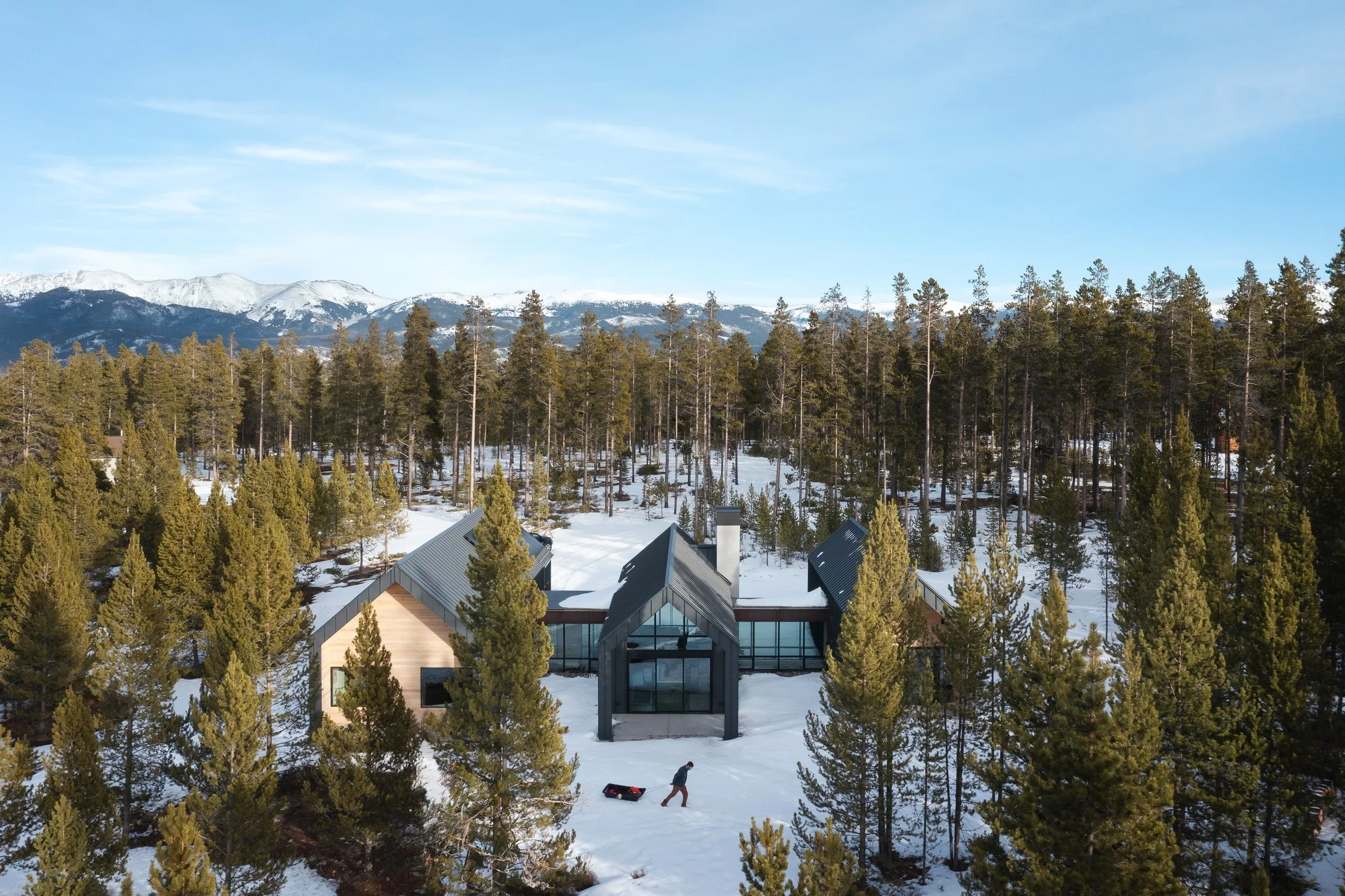 TwoSisters-Fraser-Exterior-Aerial-West-Elevation-PM-with-person.jpg