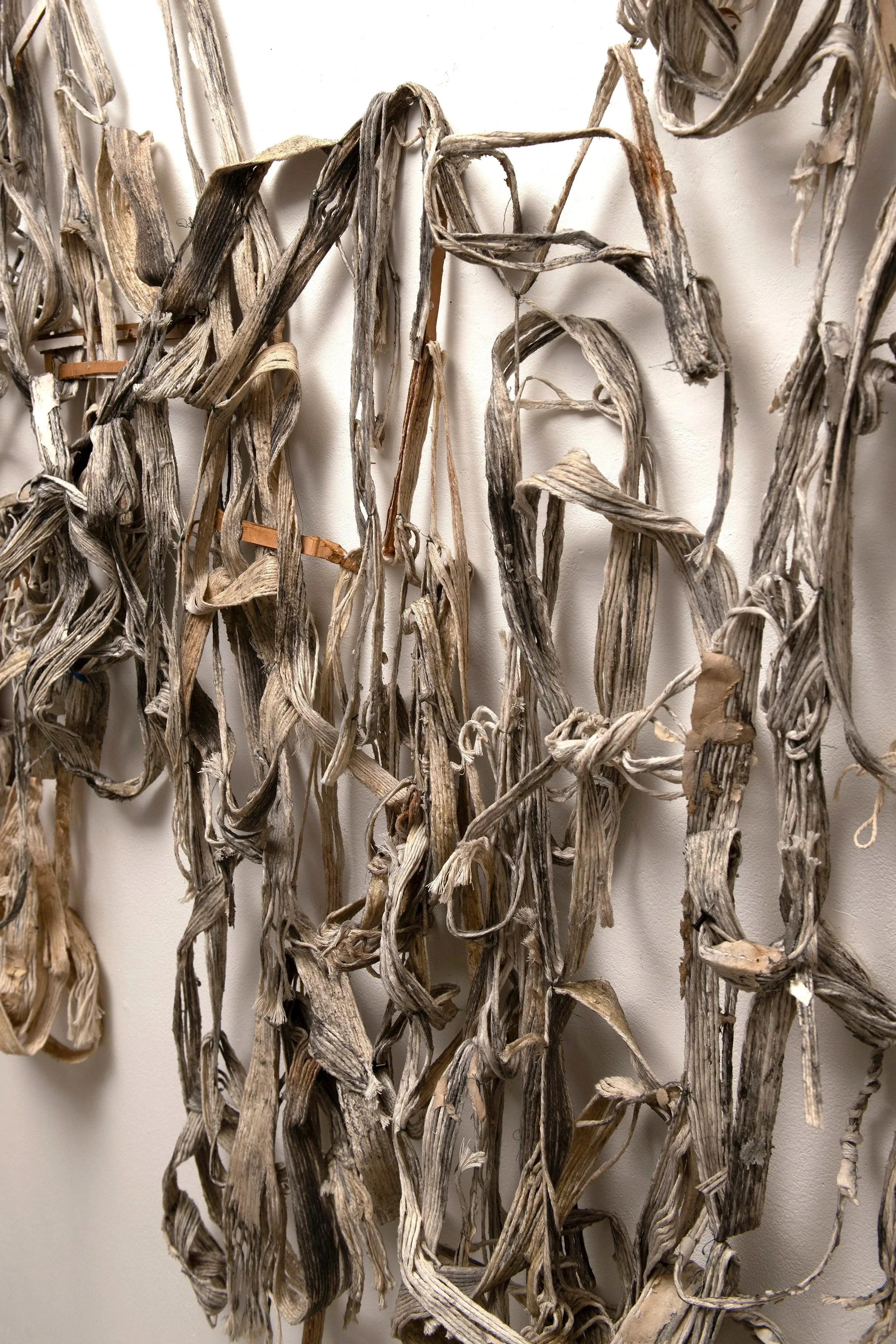   Palimpsest,  detail, 2026 string, cardboard, paint&nbsp; 96" x 180" x 12"&nbsp; 