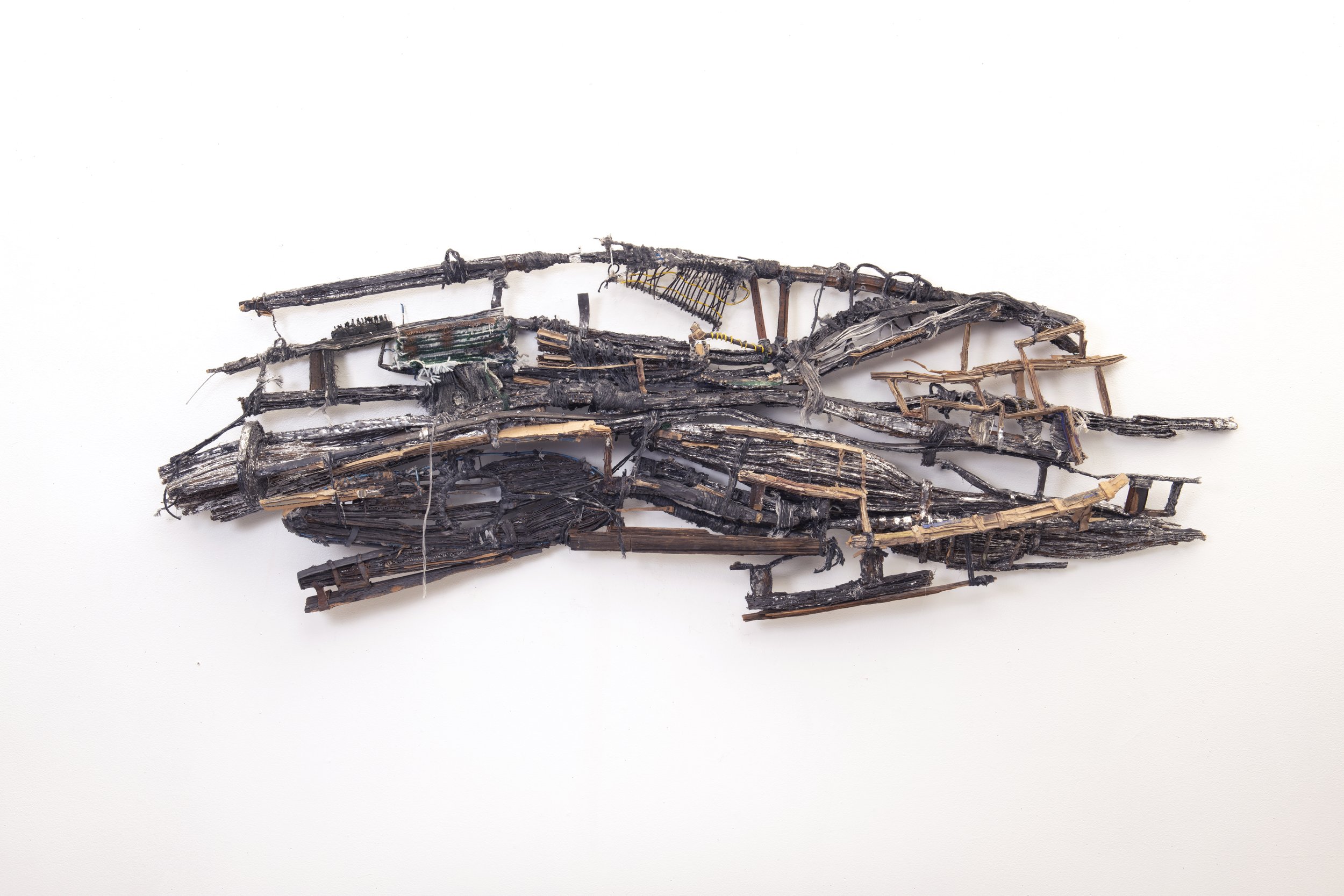   Mouth of Char,  2026 cardboard, paint, metal leaf, string 28" x 72" x 7"&nbsp;&nbsp; 