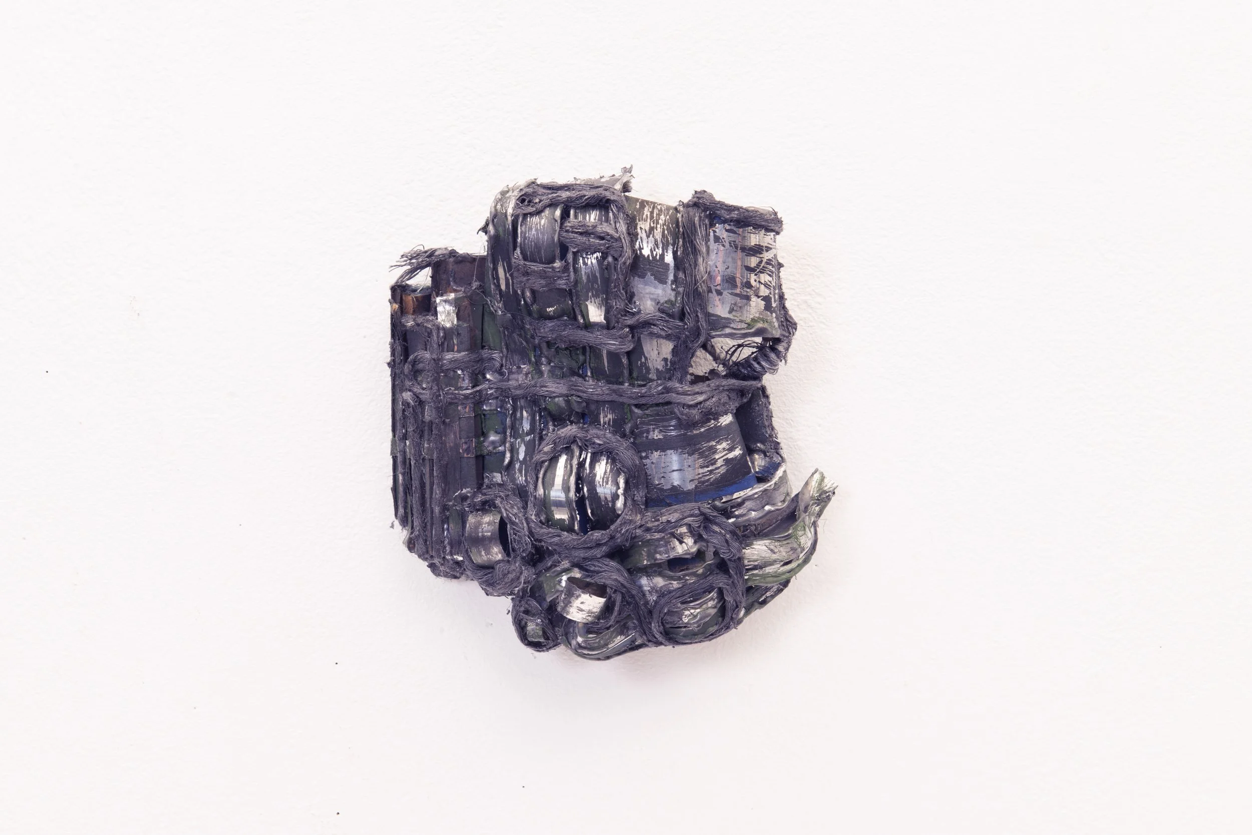   Of Ash , 2025 mylar string, paint, spice 7.5" x 6" x 2.5" 