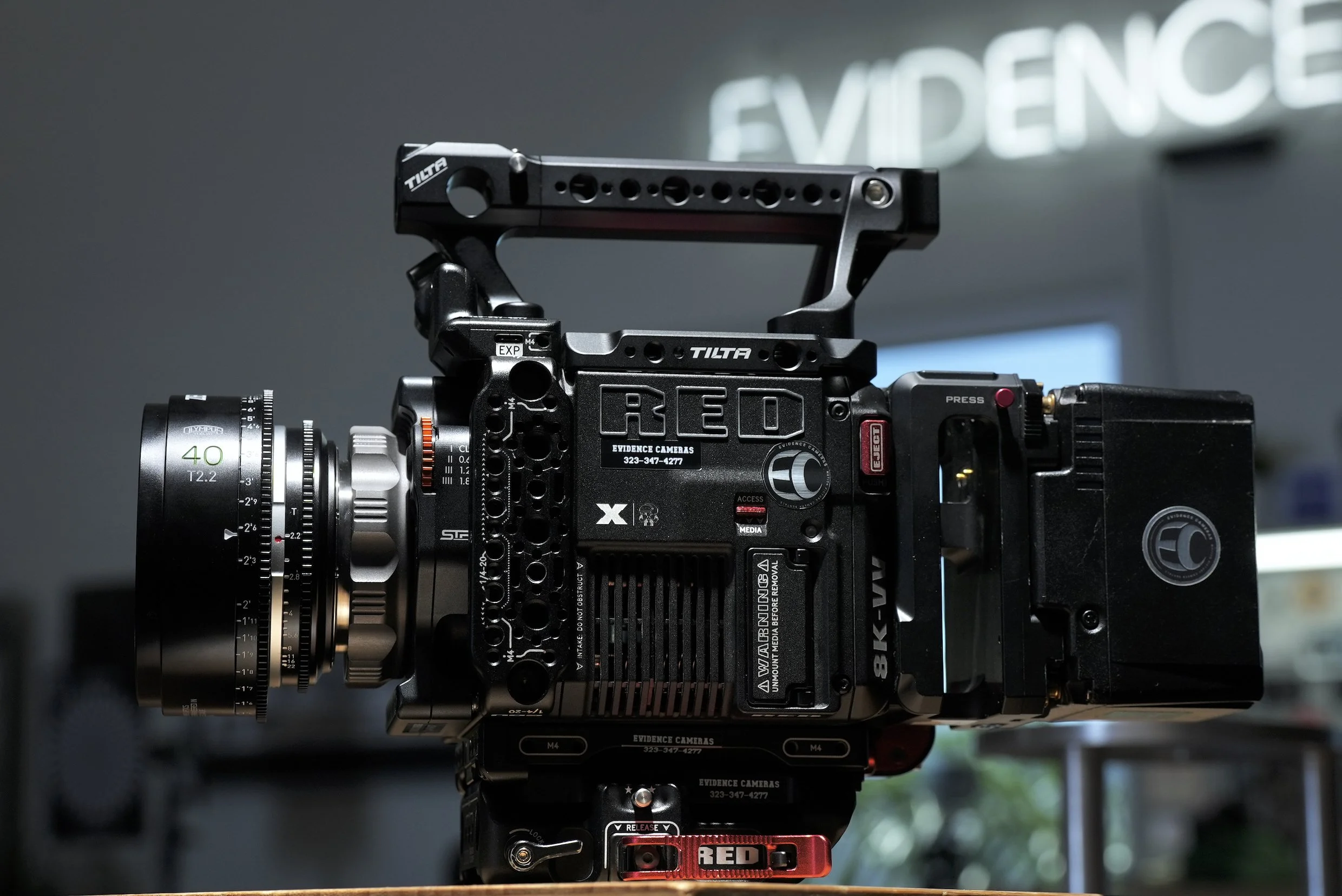 Professional video camera used for filmmaking or video production, mounted on a sturdy support.