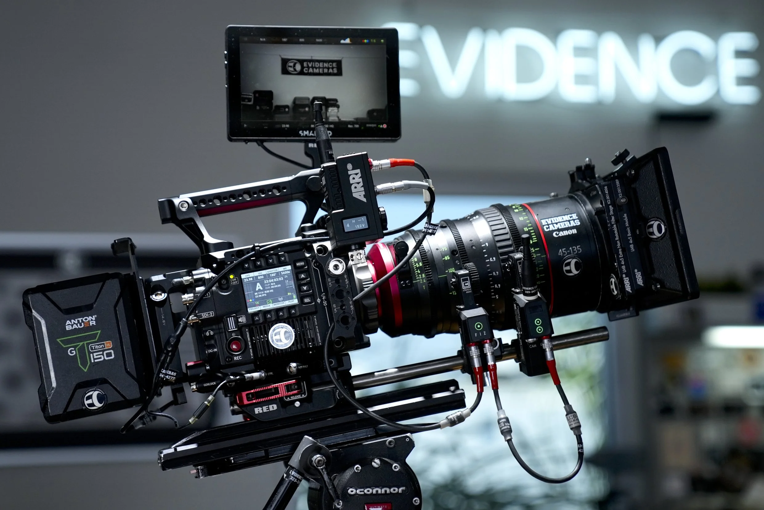 Professional motion picture camera setup with external monitor and various attachments, used for filming.