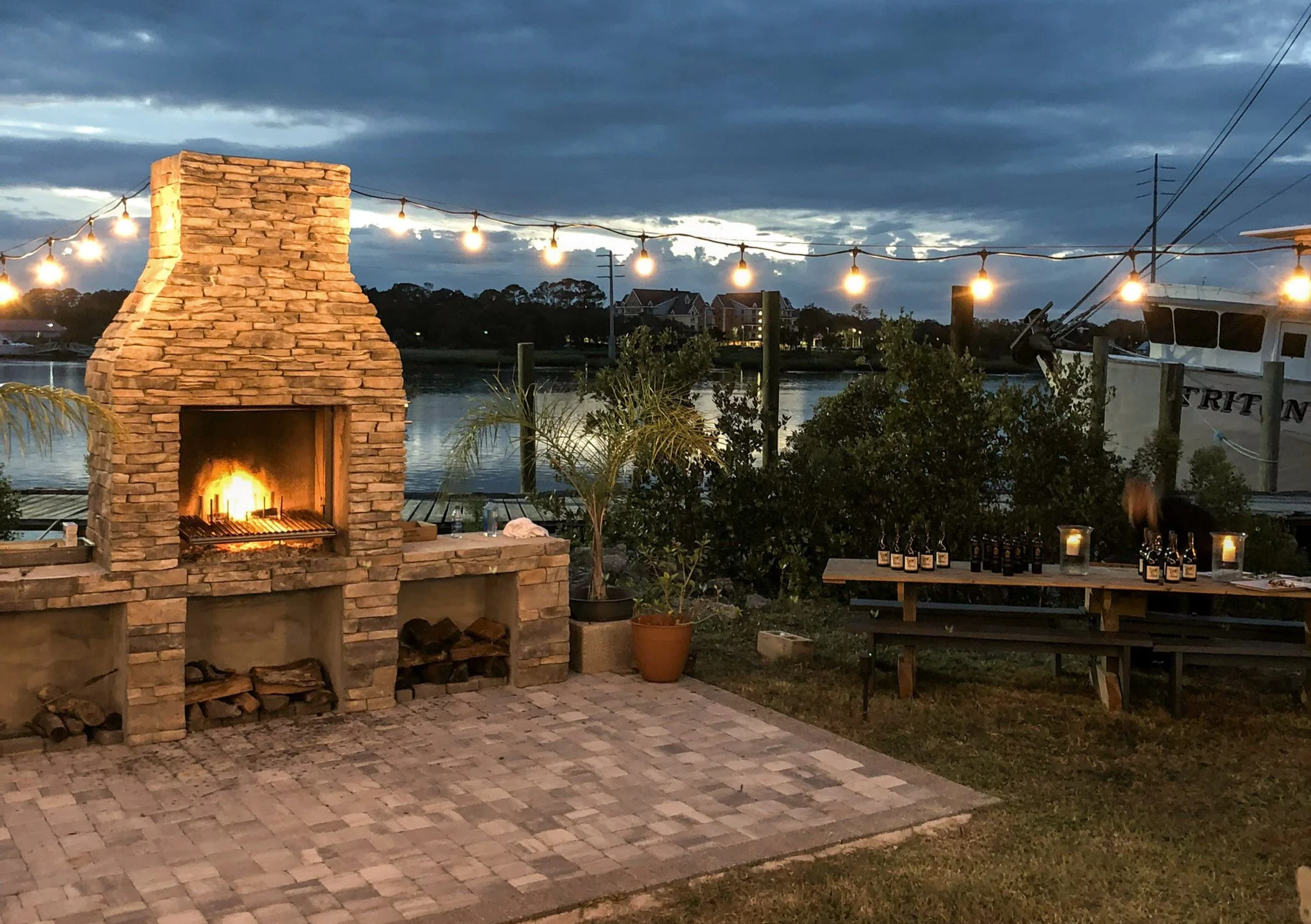 Event setup at Urban Asado, Asado Life’s grill fabrication studio, showcasing the industrial space and live-fire event setting.
