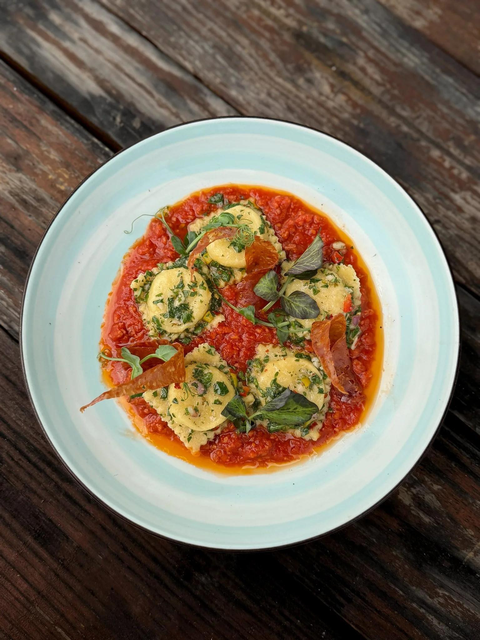 House-made Double Cheese Potato Ravioli in a Malbec-infused Chorizo Ragú