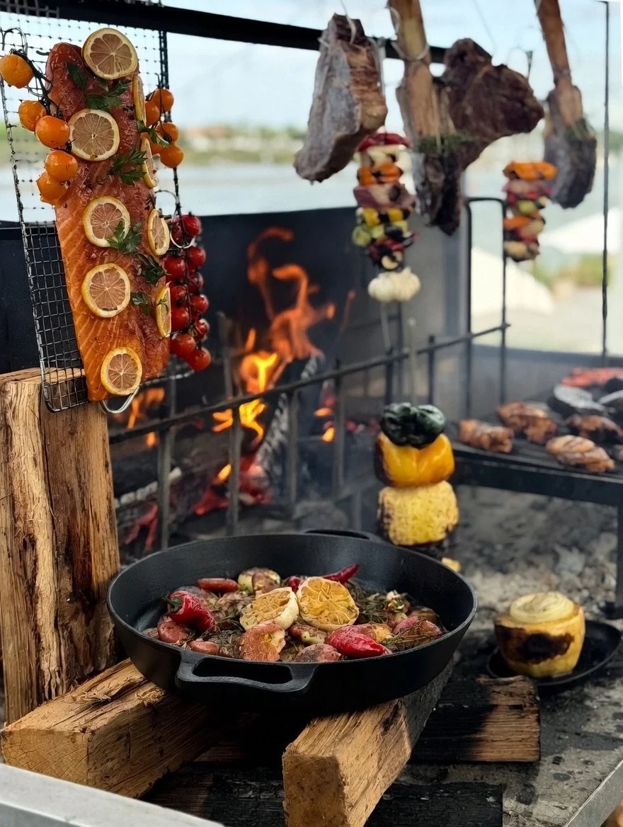 Smithey ironware cooking on a parrilla grill spread
