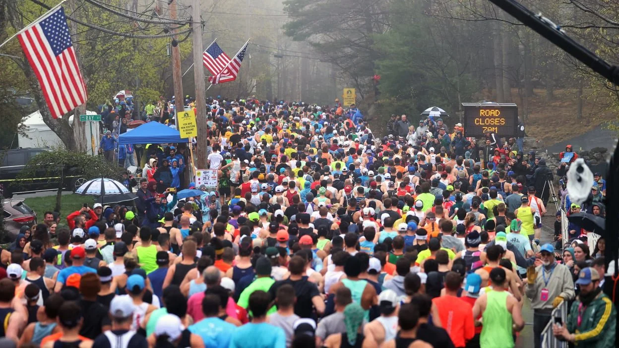 Colorful runners crowded at the start of the race.