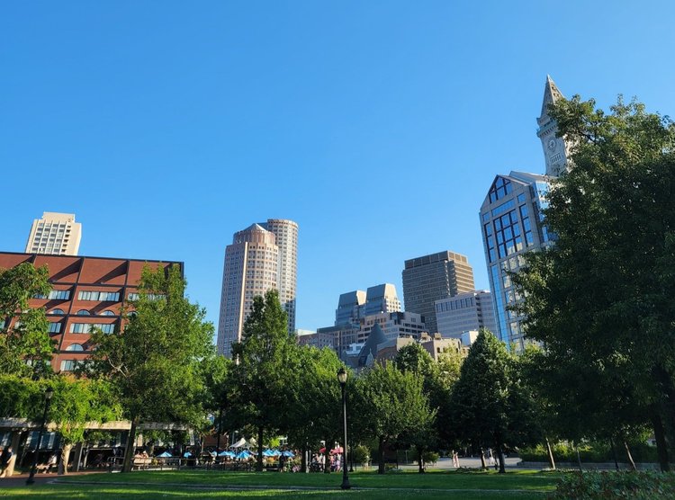 Panoramic view of the Rose Kennedy Greenway park with Boston skyline
