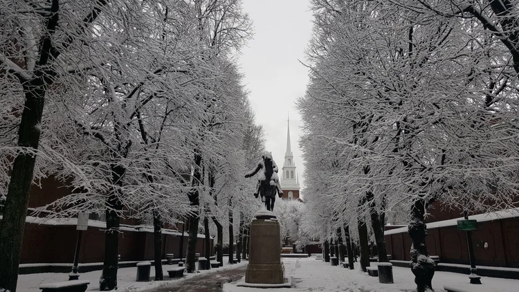 Paul Revere statue with the Old North Church steeple in the background