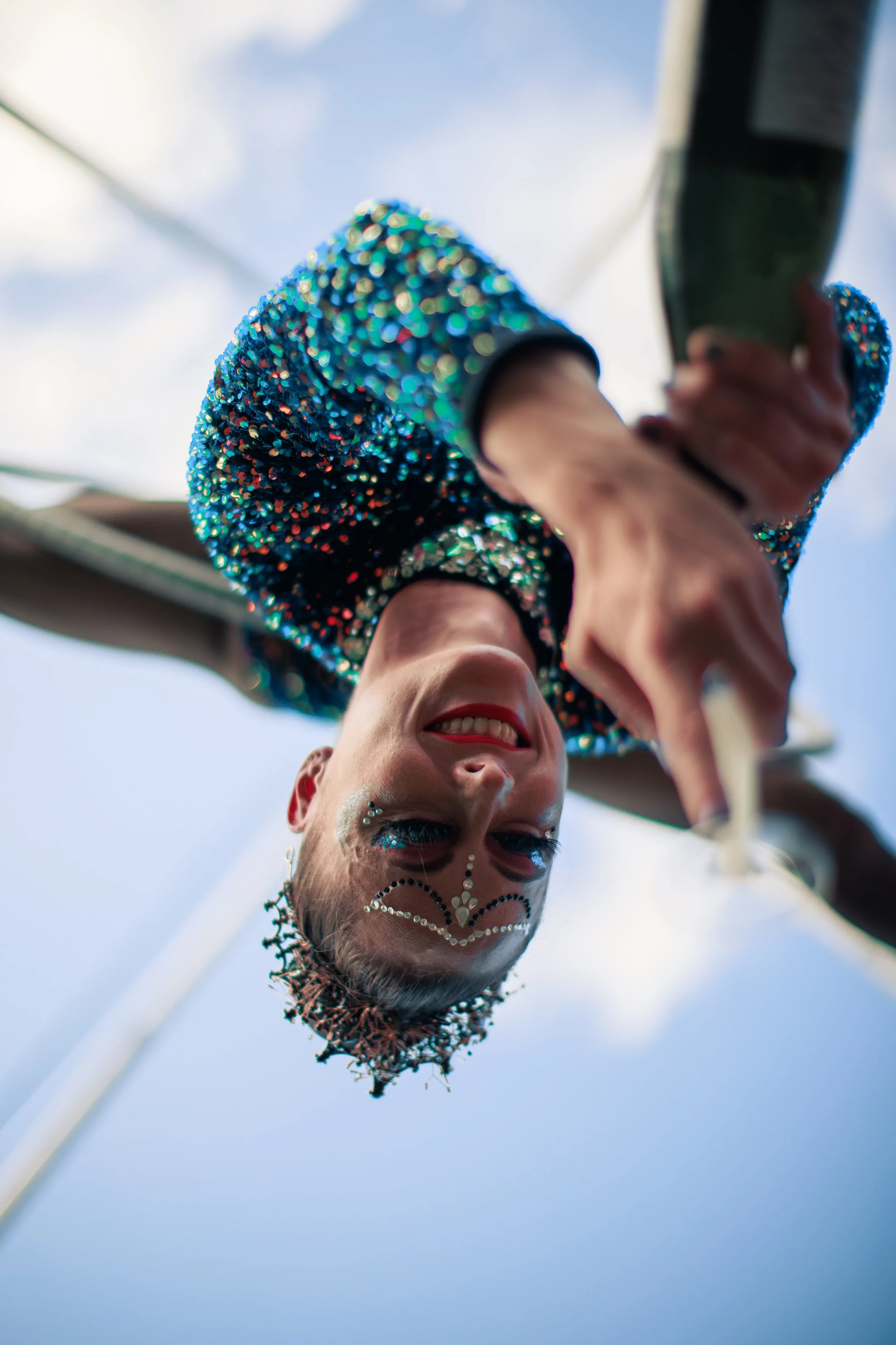 Aerialist pouring champagne