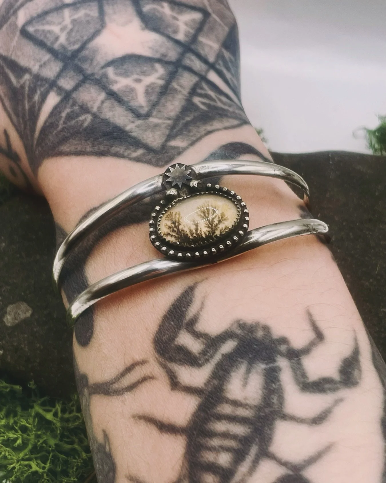 From my Medieval Devilry II collection: the Lyrid Cuff. Handmade in recycled Sterling silver, the Lyrid cuff features a dendritic agate doublet set under a shooting star. A nighttime moorland scene you can wear.

This cutie sold straight away but I h