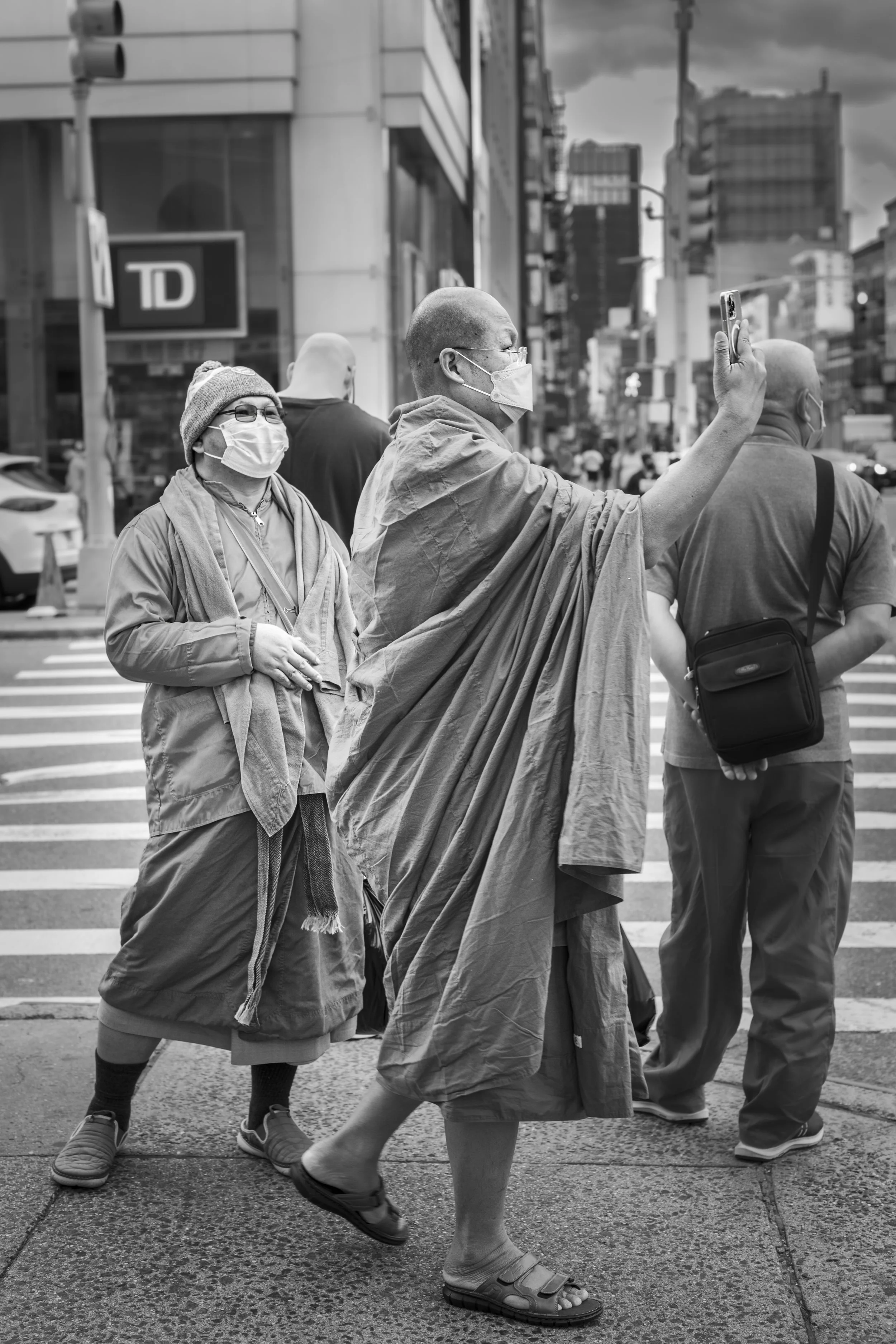 Two monks with cell phone.jpg