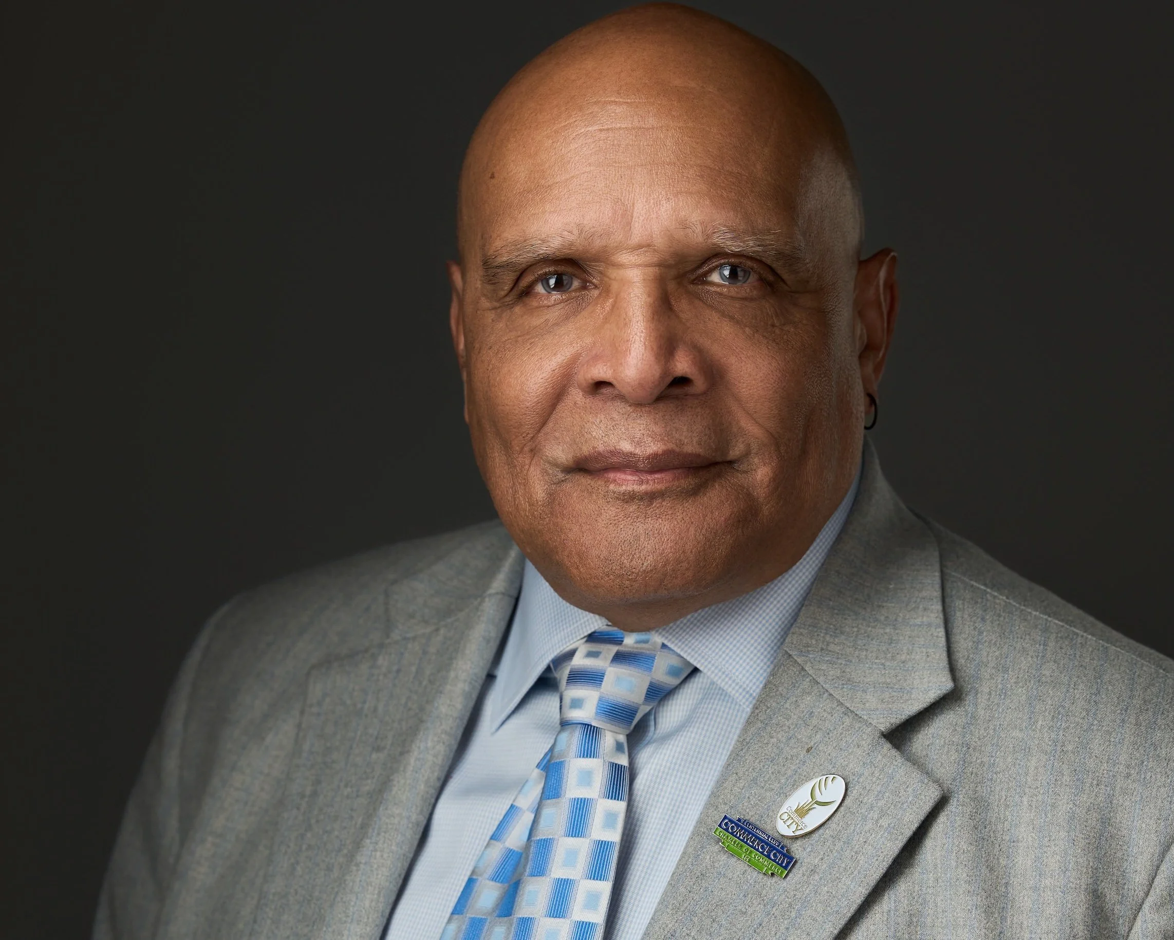 Professional headshot of man in a suit and tie in Aurora Colorado