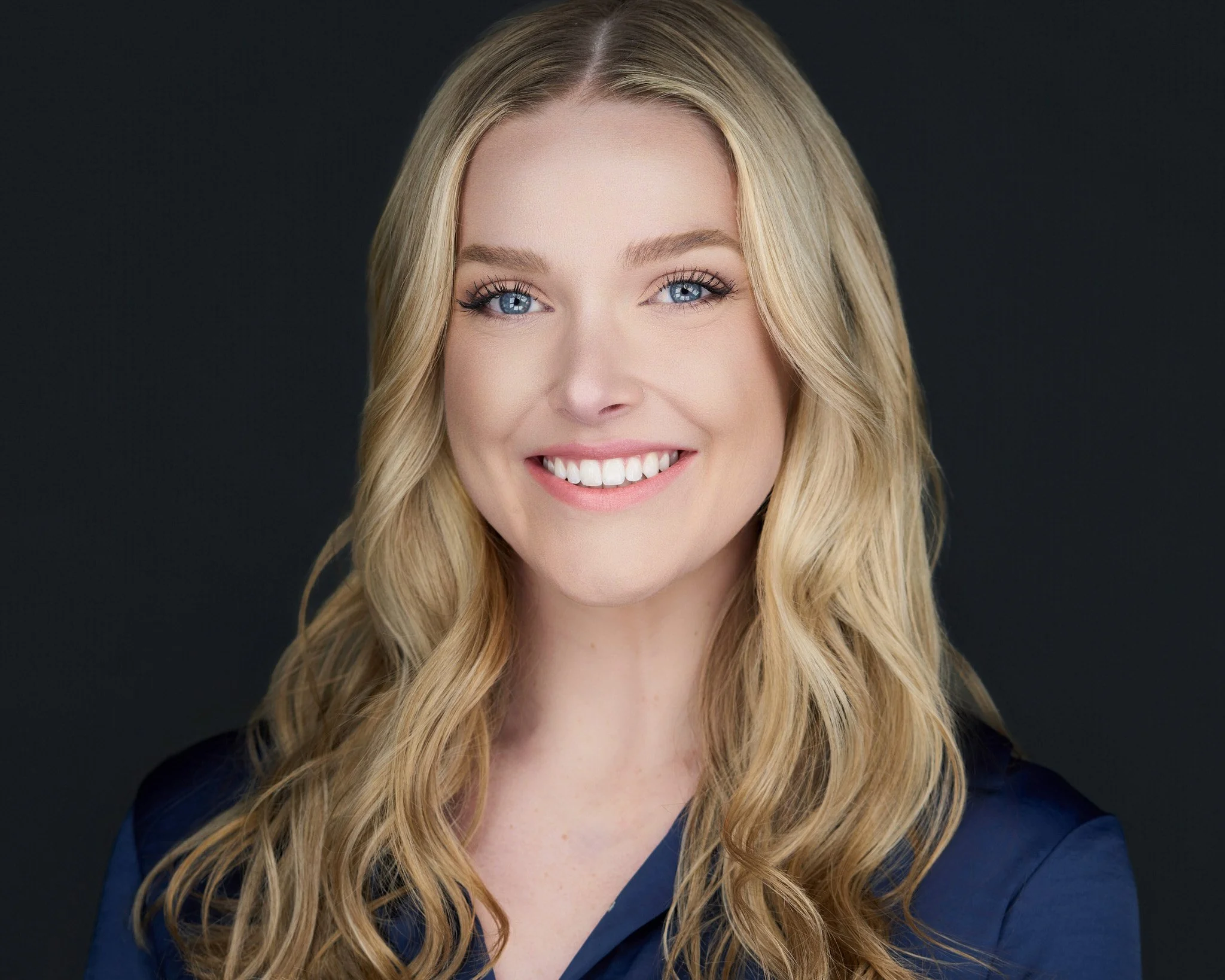 Professional headshot in Denver featuring a confident woman with a warm smile, perfect for business profiles, corporate bios, and LinkedIn branding.